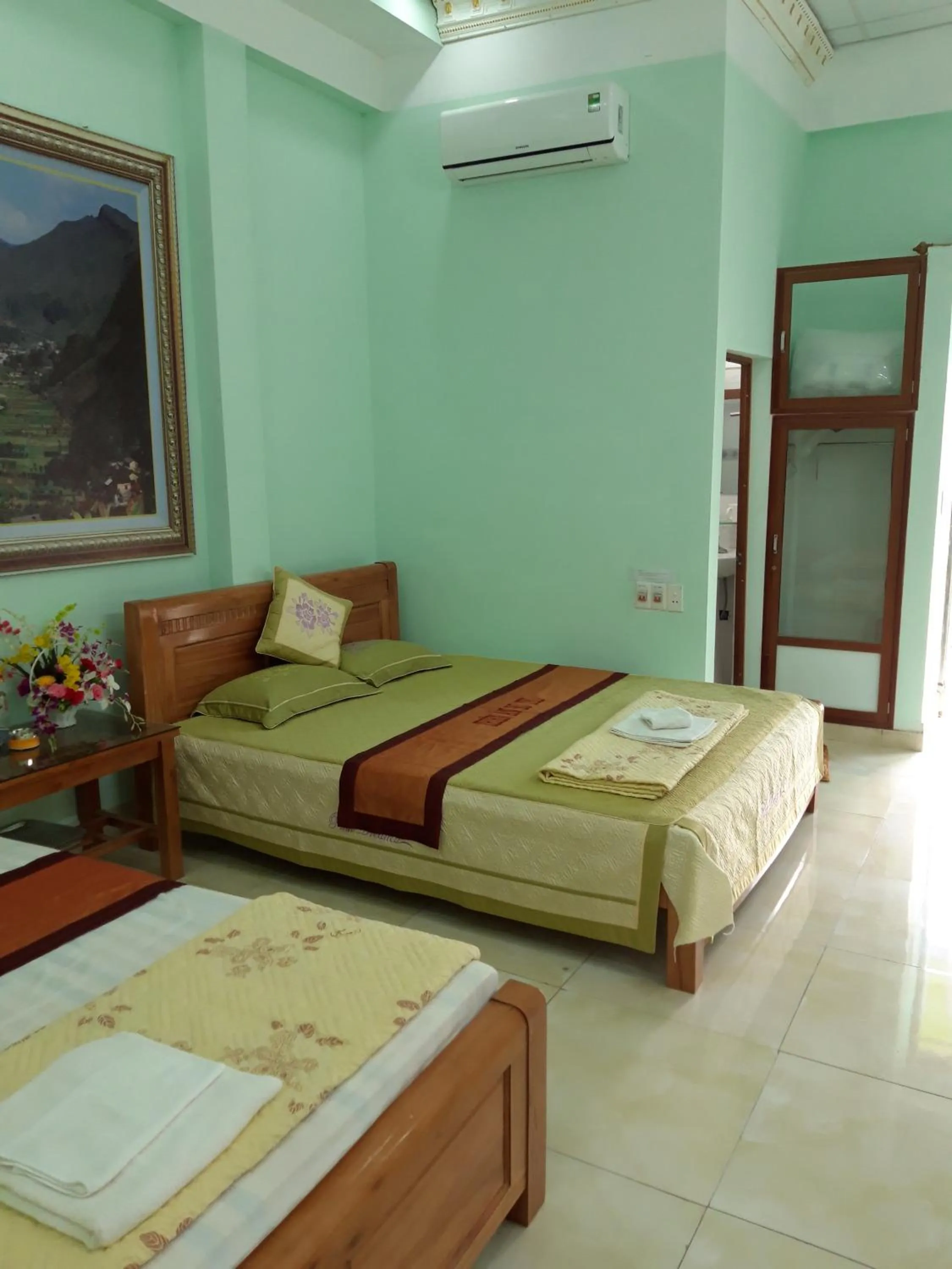 Bed in Yen Minh Hotel Thien An