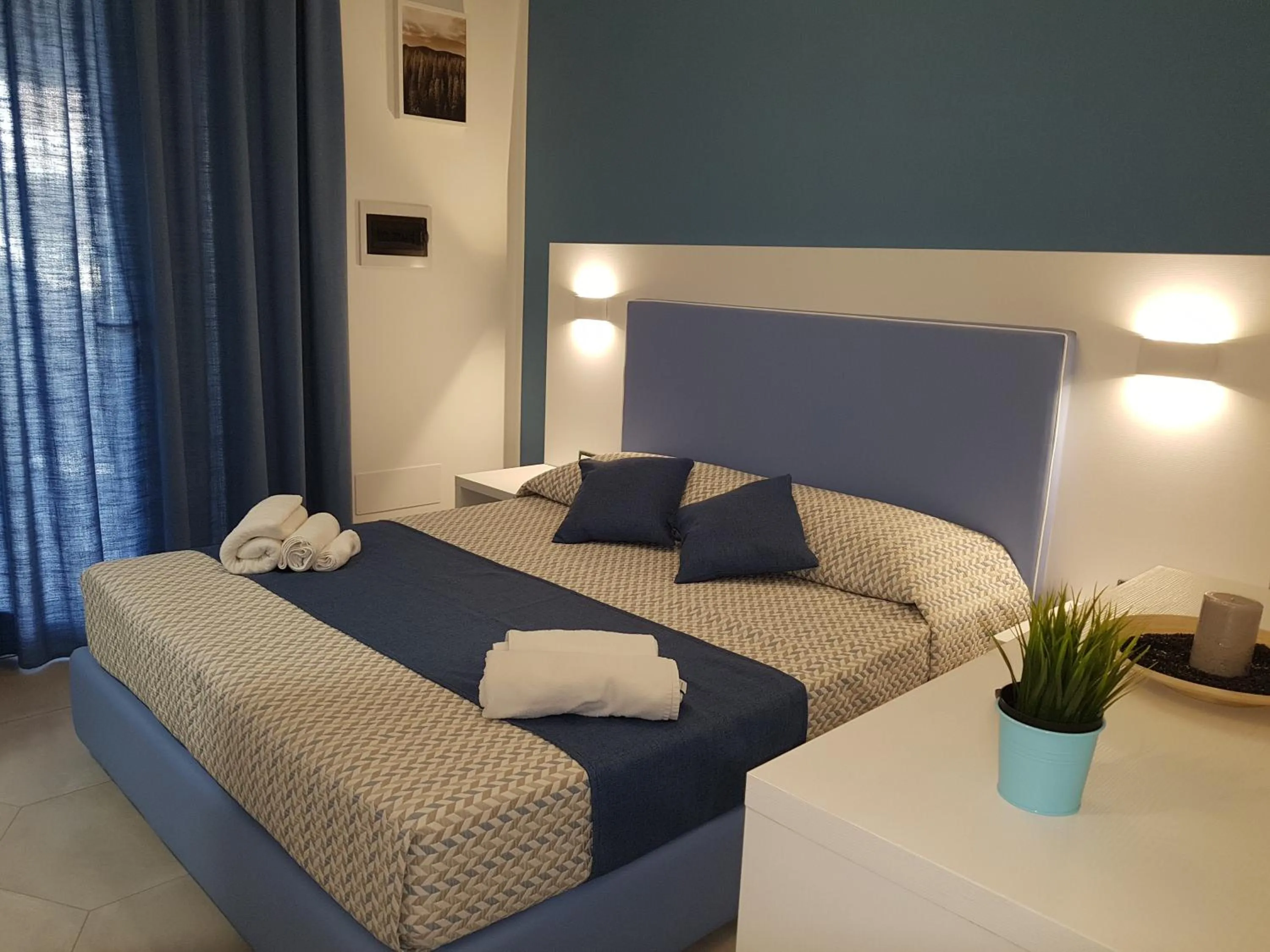 Bed in B&B Aloe Comfort Rooms