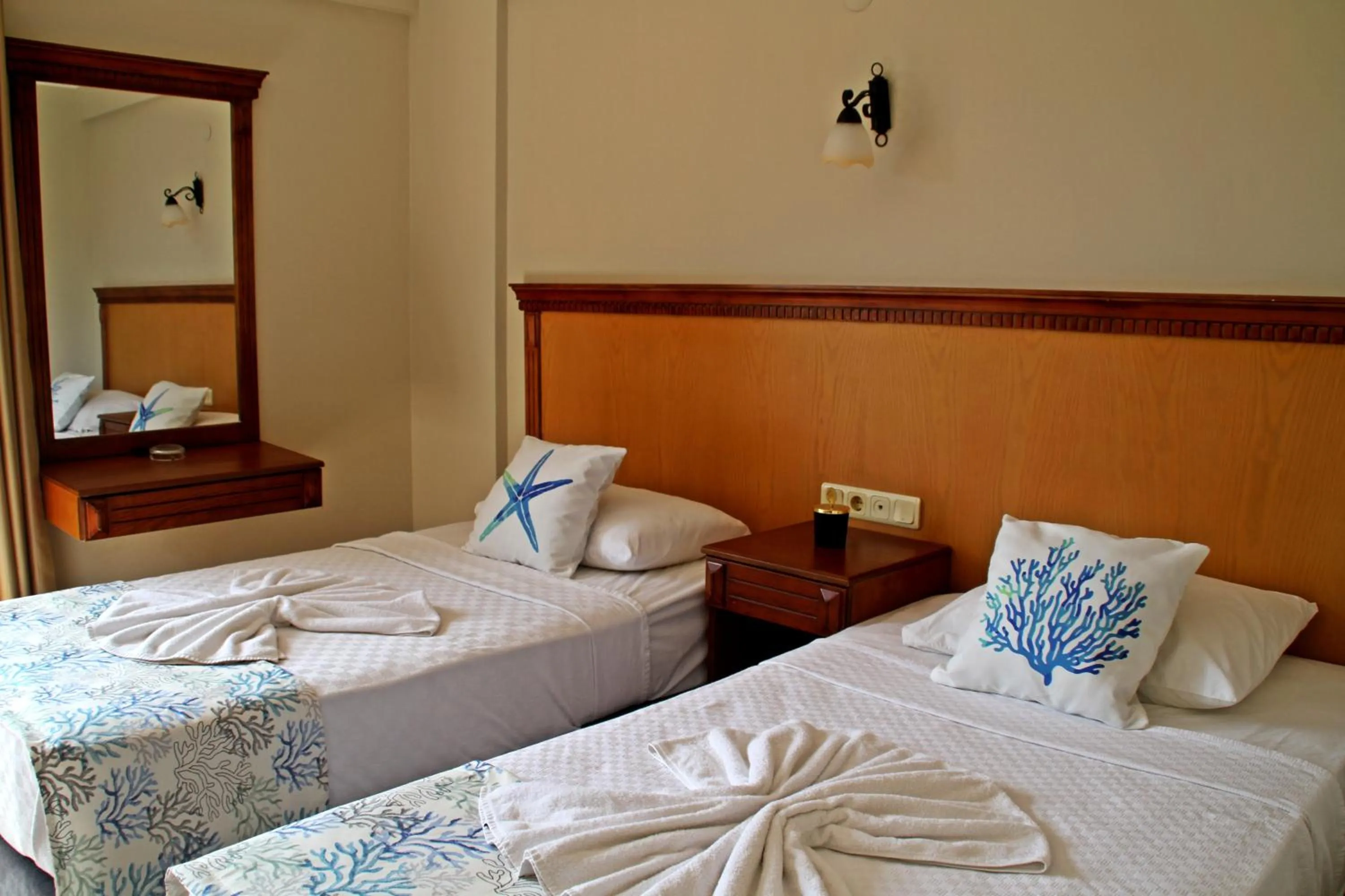 Bed in Rosy Suites Hotel