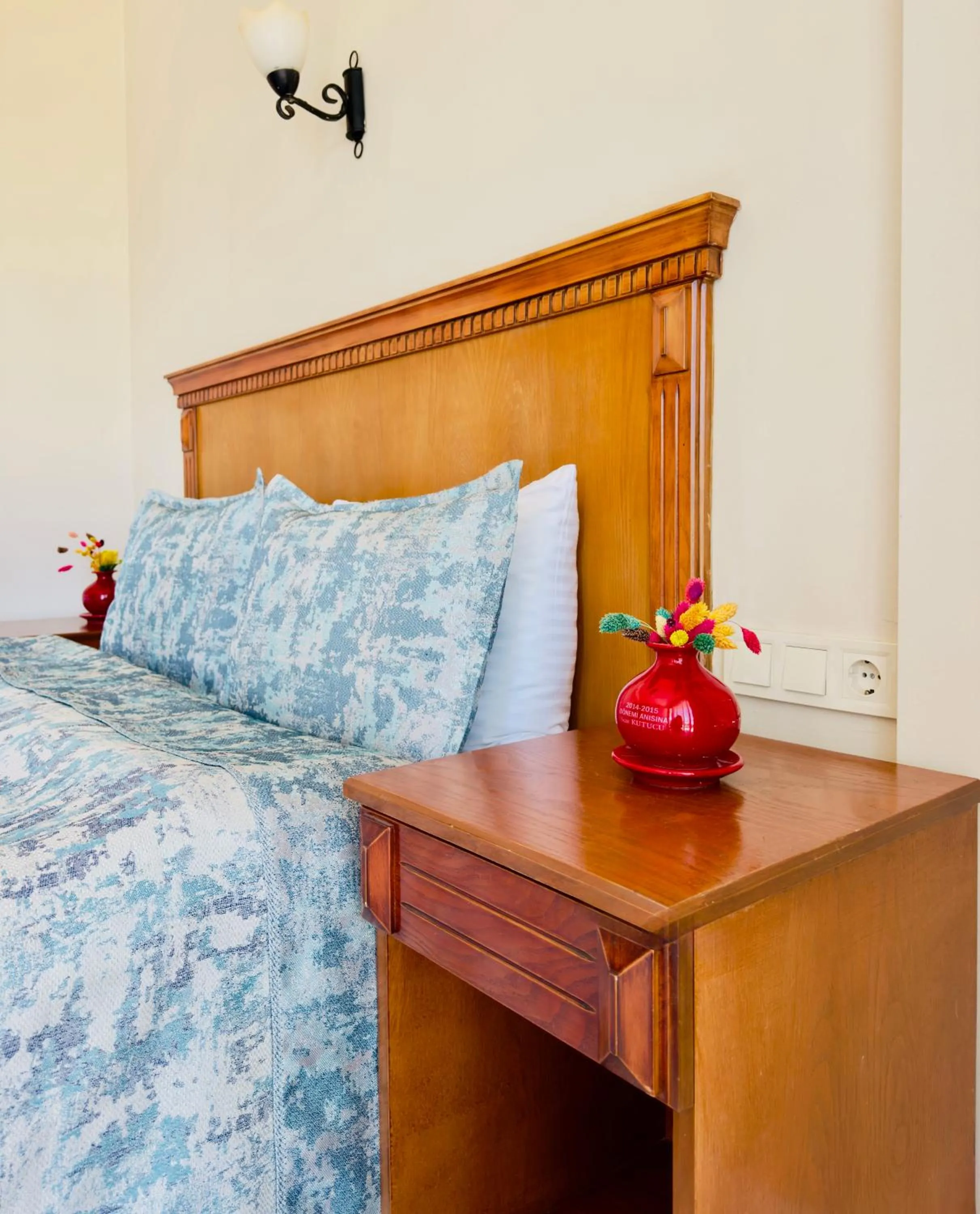 Bed in Rosy Suites Hotel