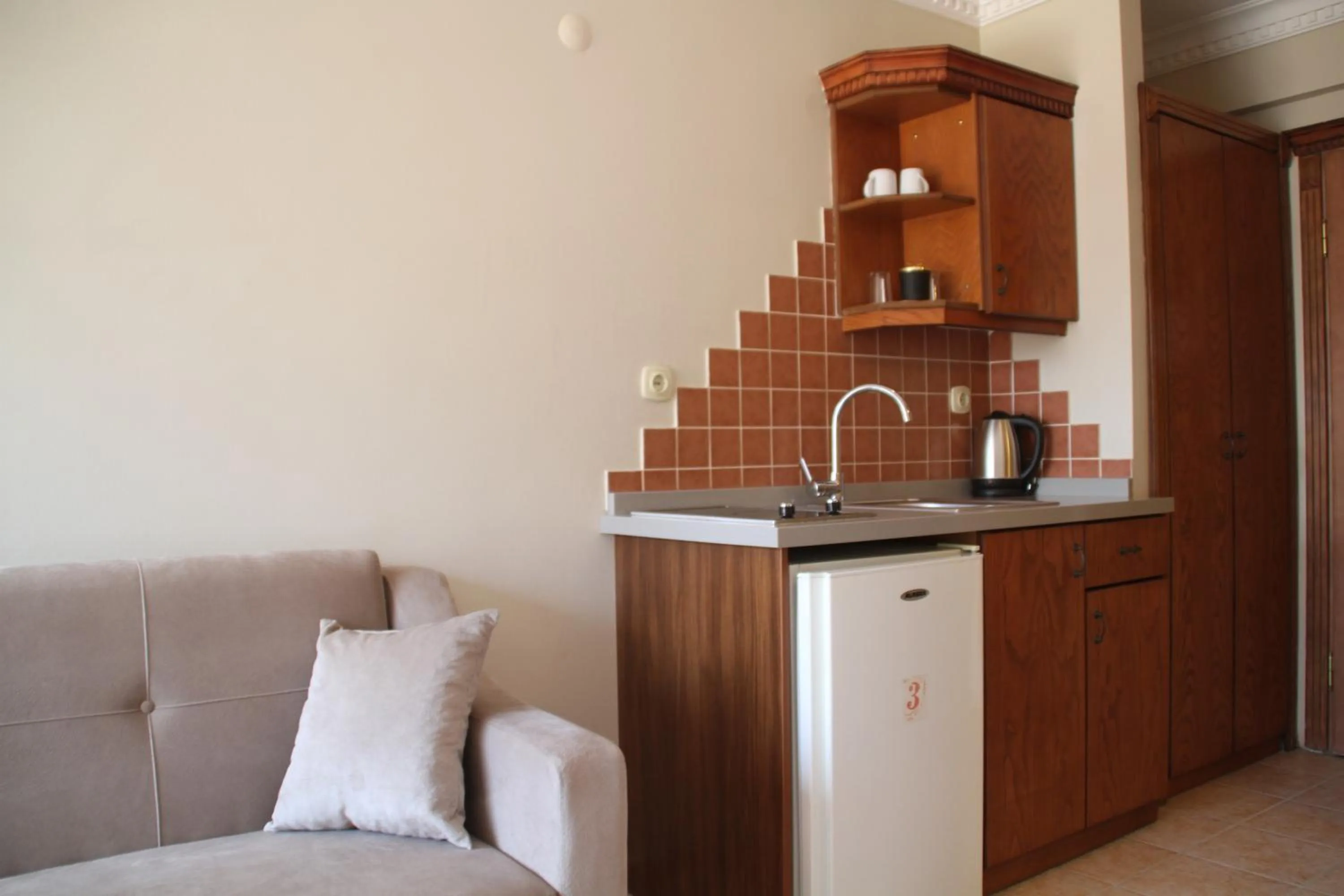 Kitchen or kitchenette in Rosy Suites Hotel