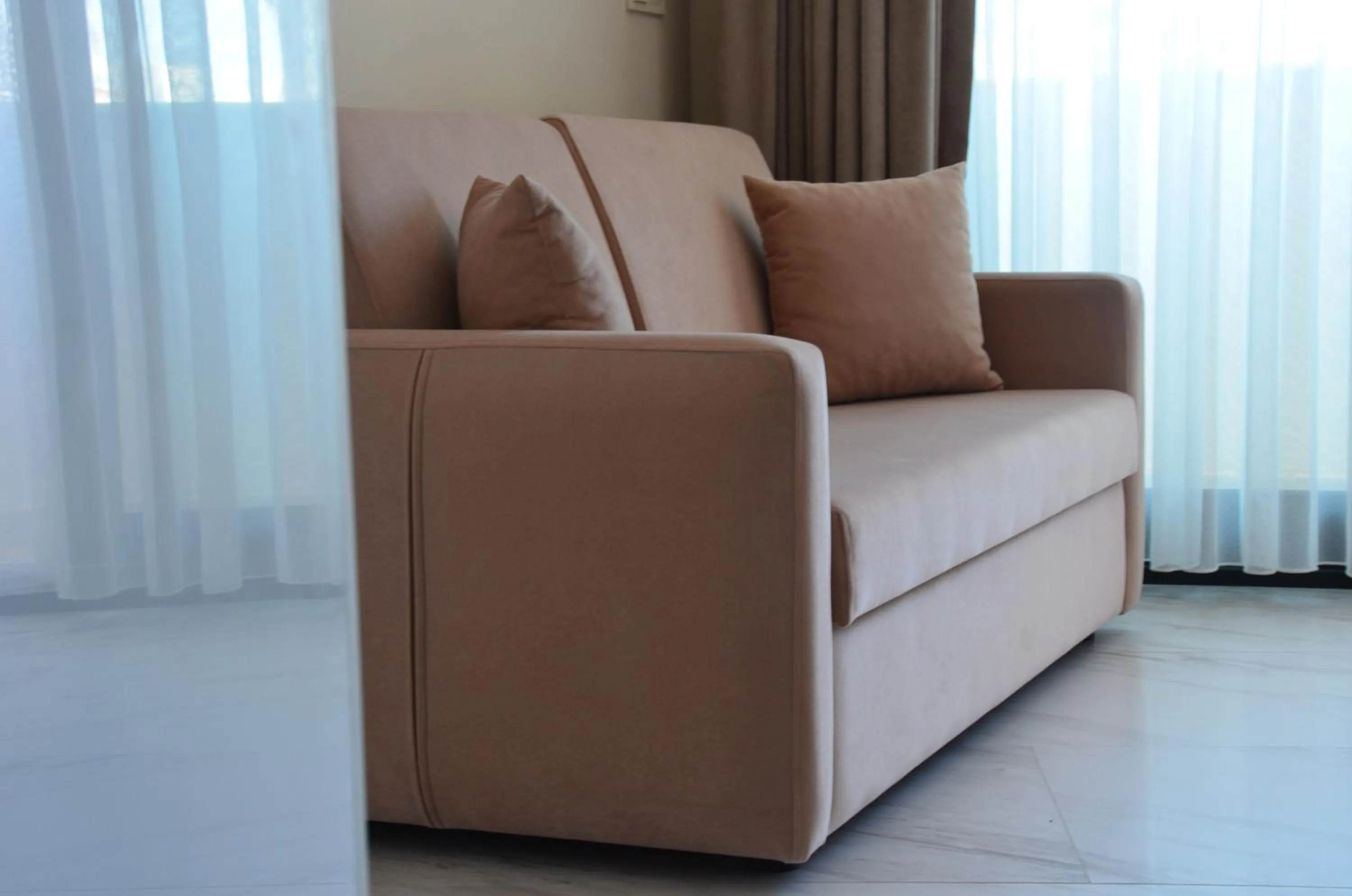 Communal lounge/ TV room in Rosy Suites Hotel