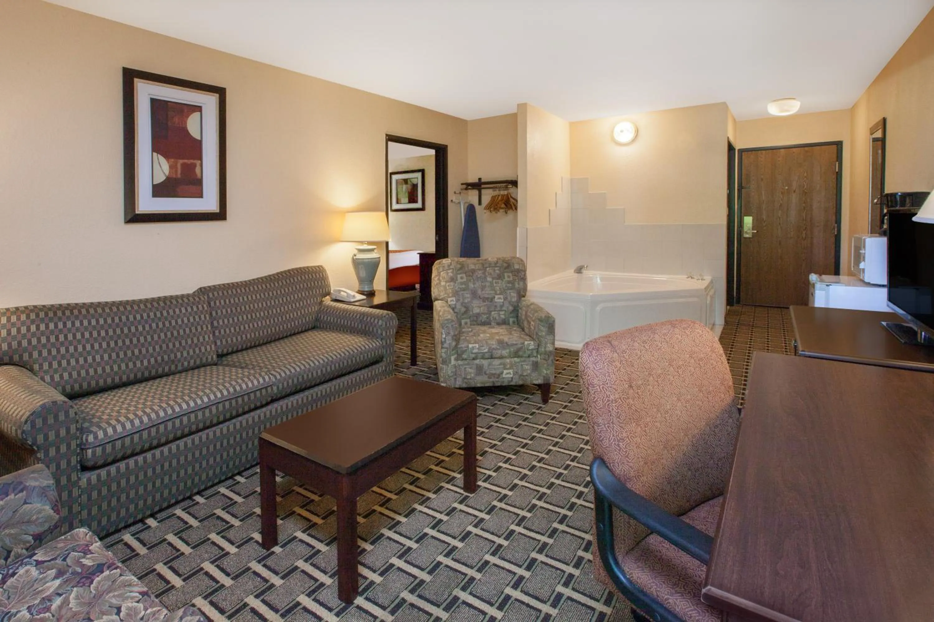 Communal lounge/ TV room in Days Inn & Suites by Wyndham Madison Heights MI