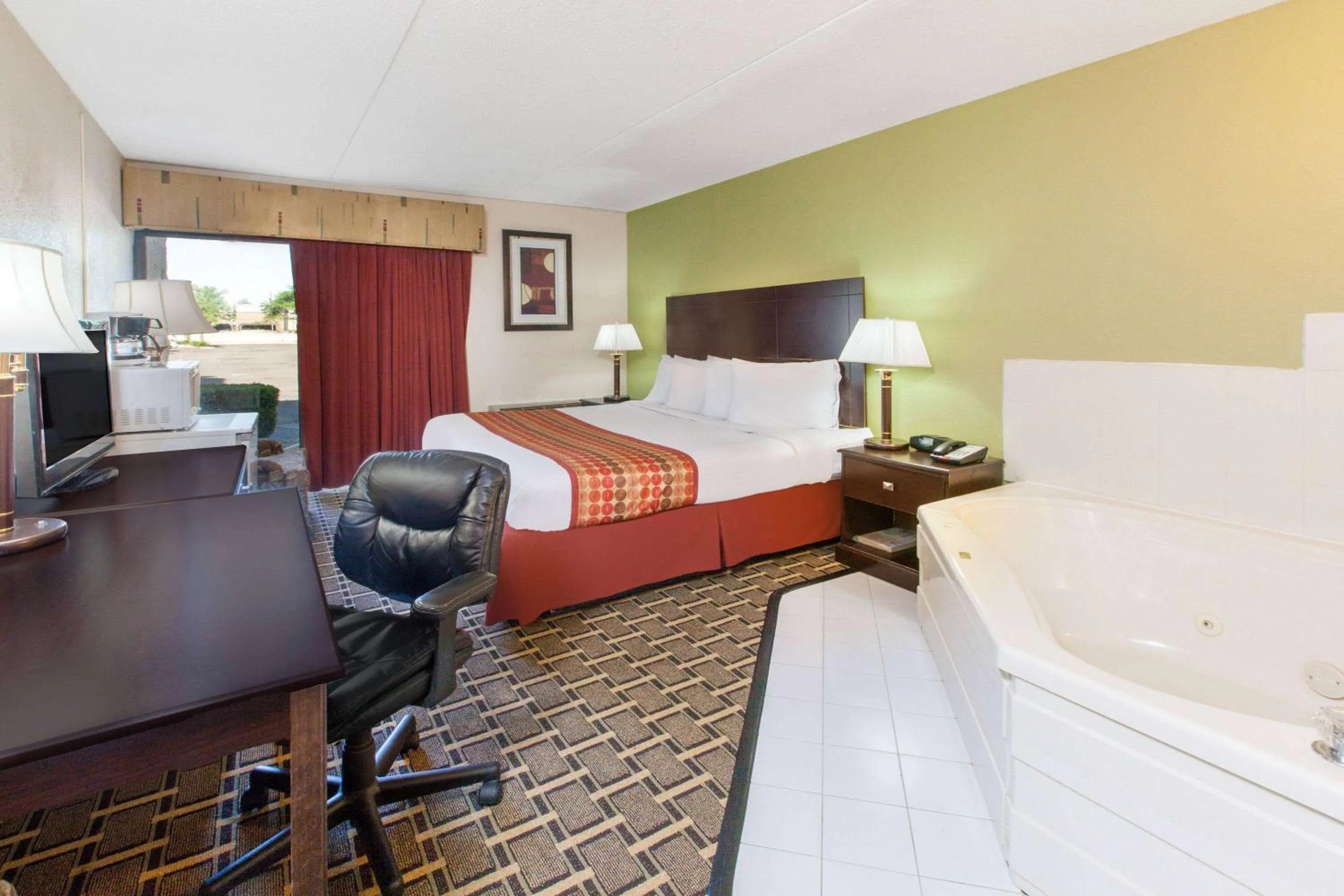 Photo of the whole room, Bed in Days Inn & Suites by Wyndham Madison Heights MI