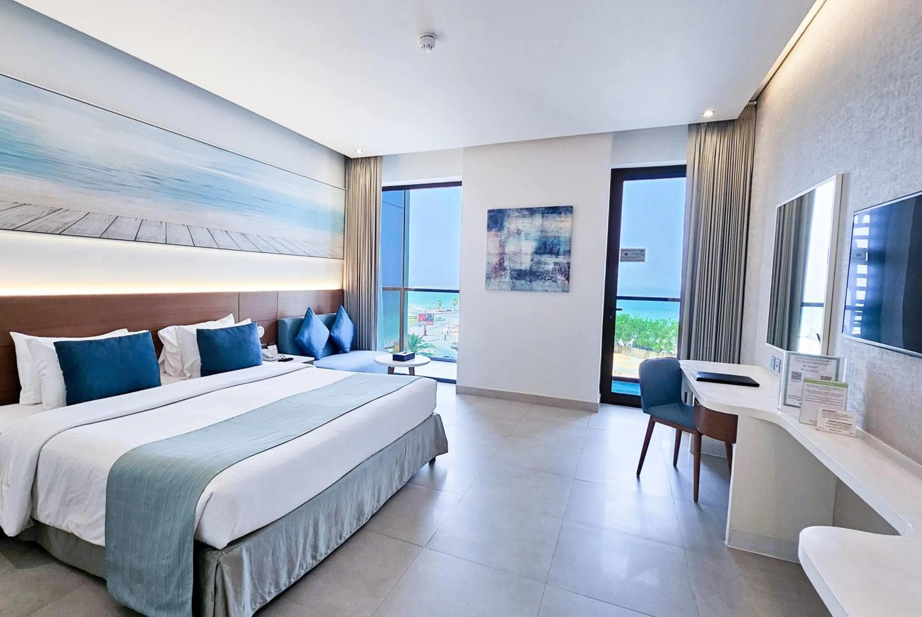 Photo of the whole room, Bed in Wyndham Garden Ajman Corniche
