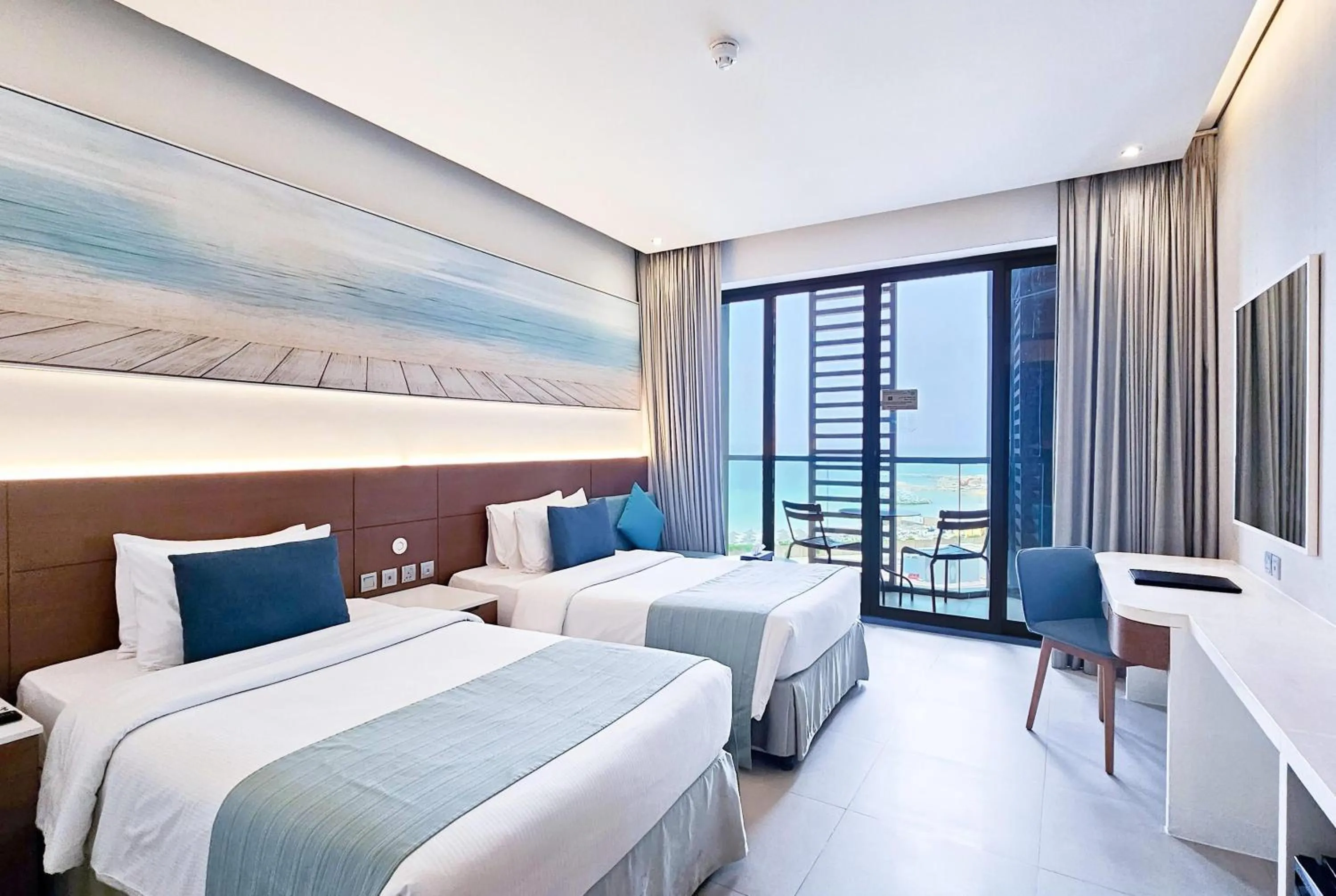 Photo of the whole room, Bed in Wyndham Garden Ajman Corniche