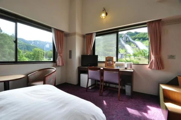 Bed in Hakuba Yamano Hotel