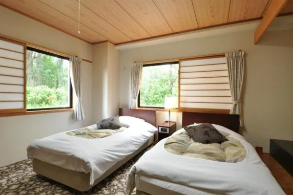 Bed in Hakuba Yamano Hotel