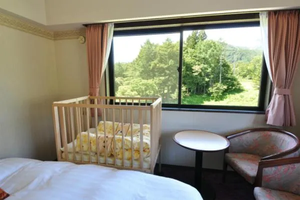 Bed in Hakuba Yamano Hotel