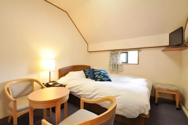 Bed in Hakuba Yamano Hotel