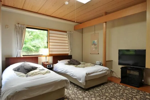 Bed in Hakuba Yamano Hotel