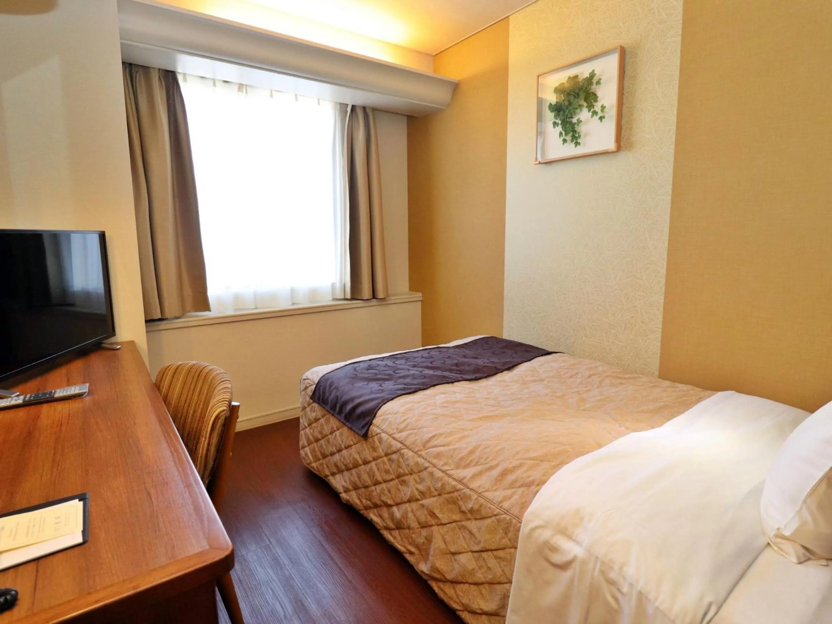 Bed in Tottori Onsen Hotel Monarque Tottori