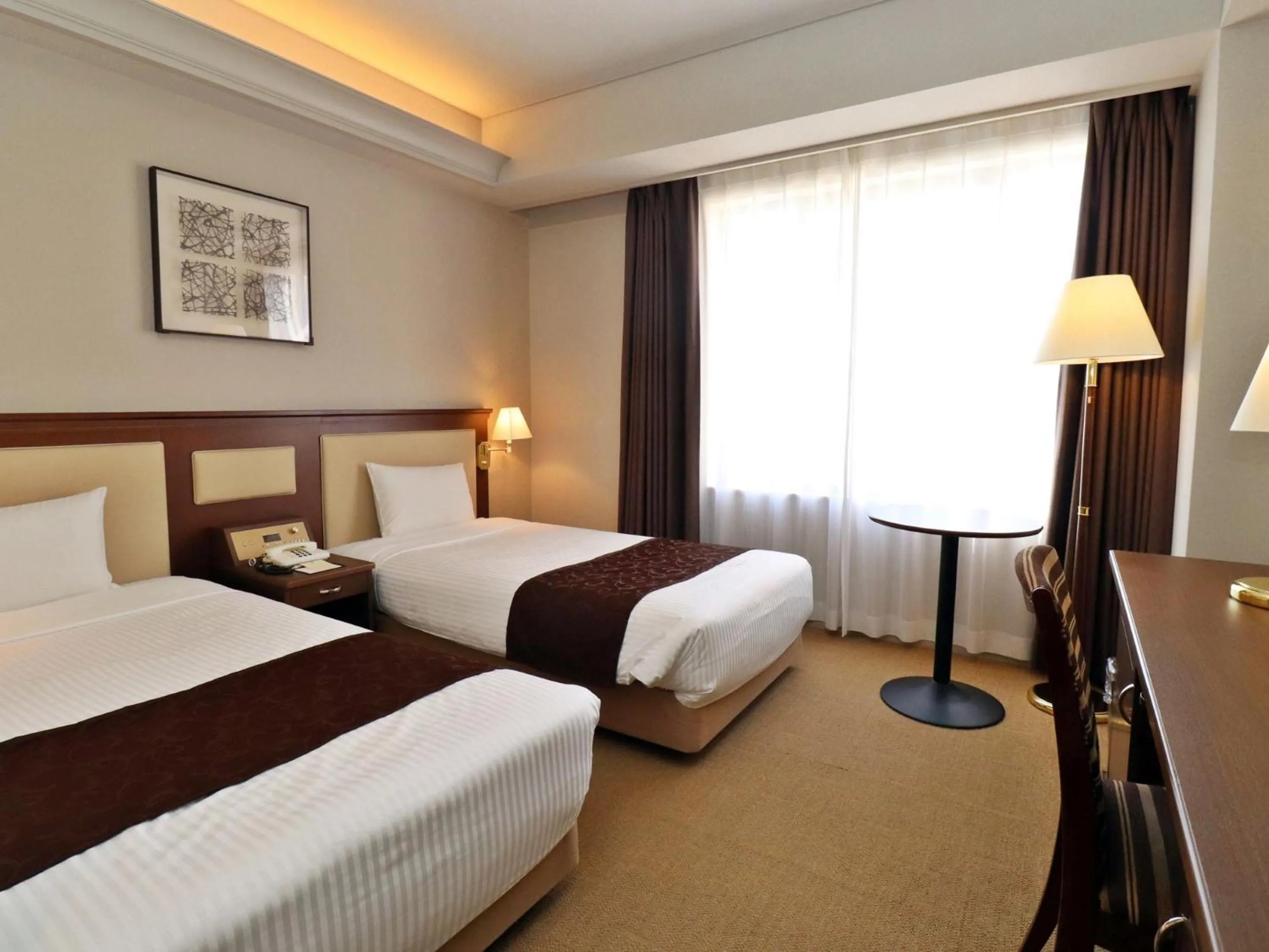 Bed in Tottori Onsen Hotel Monarque Tottori