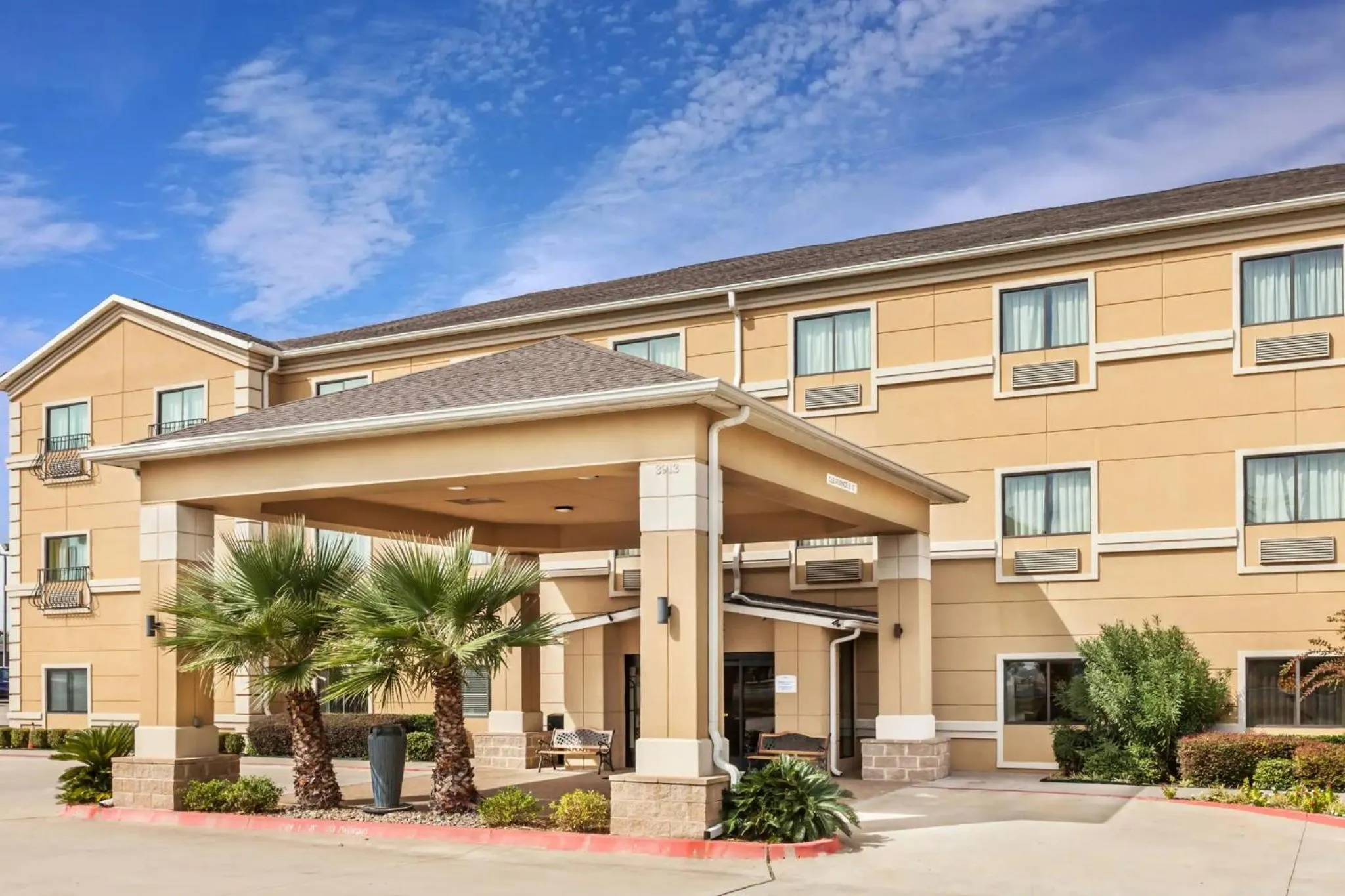 Property building in Grander Inn & Suites by IHG
