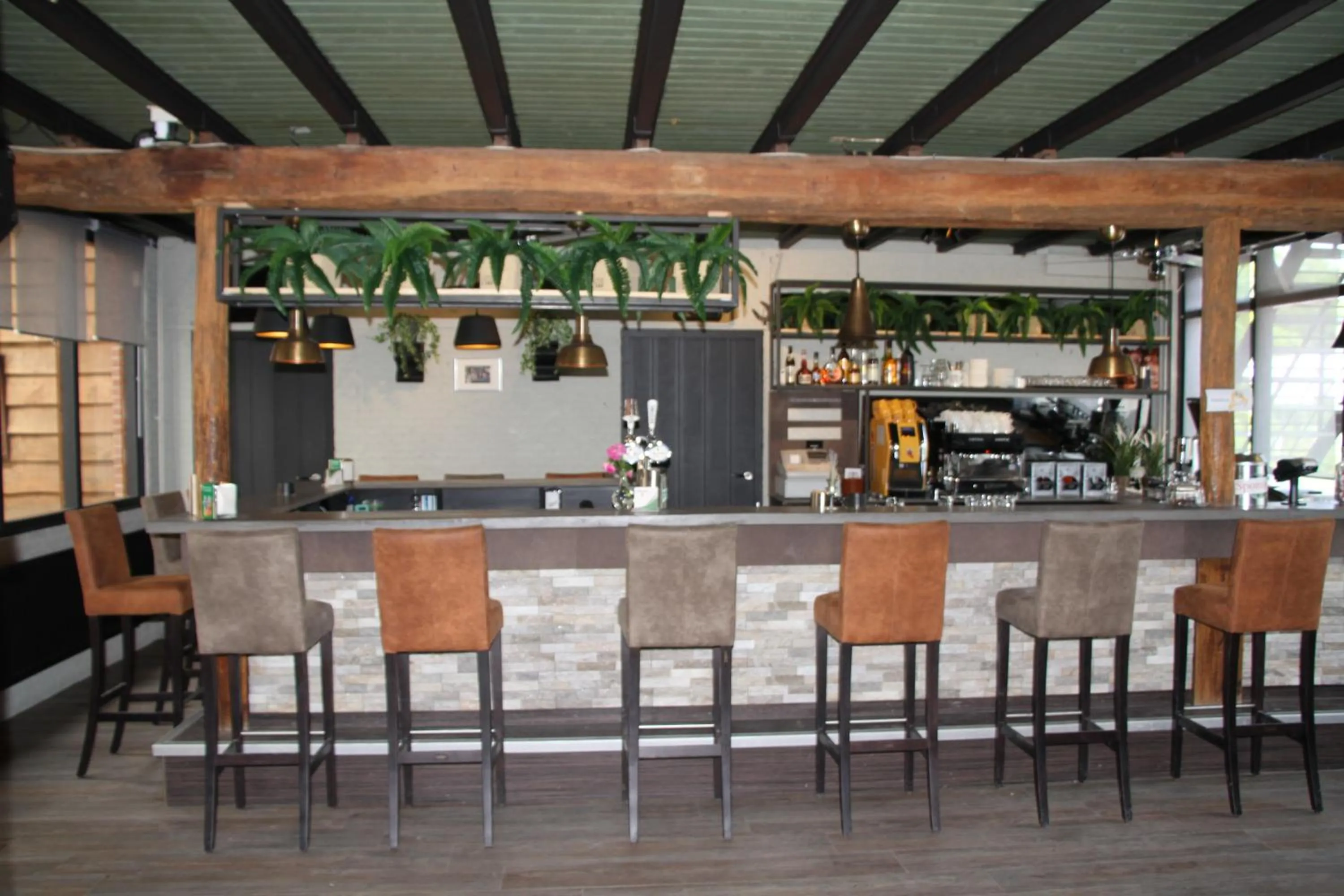 Lounge or bar in B&B de Rekkendonken