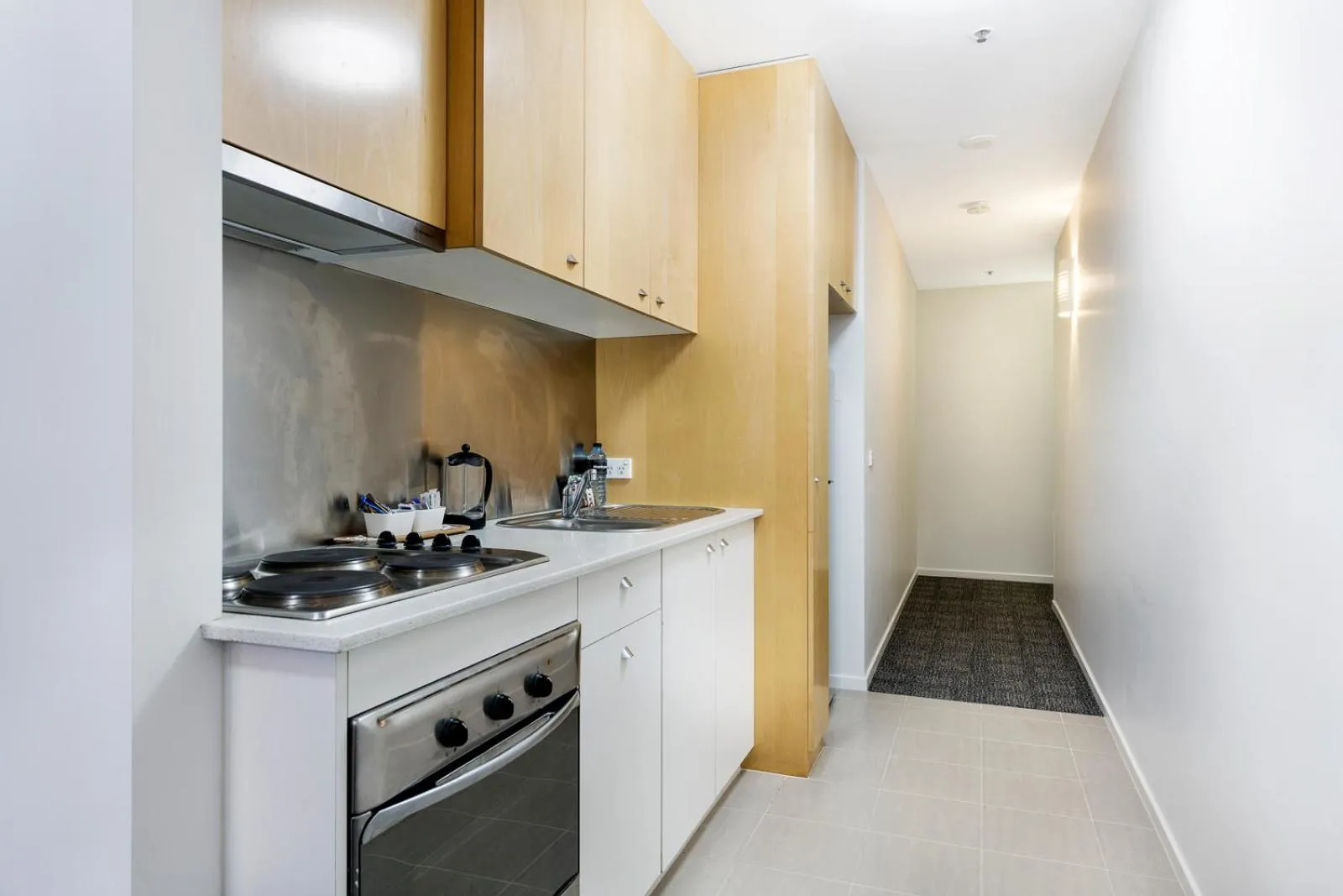 Kitchen or kitchenette in Melbourne CBD Central Apartment Hotel Official