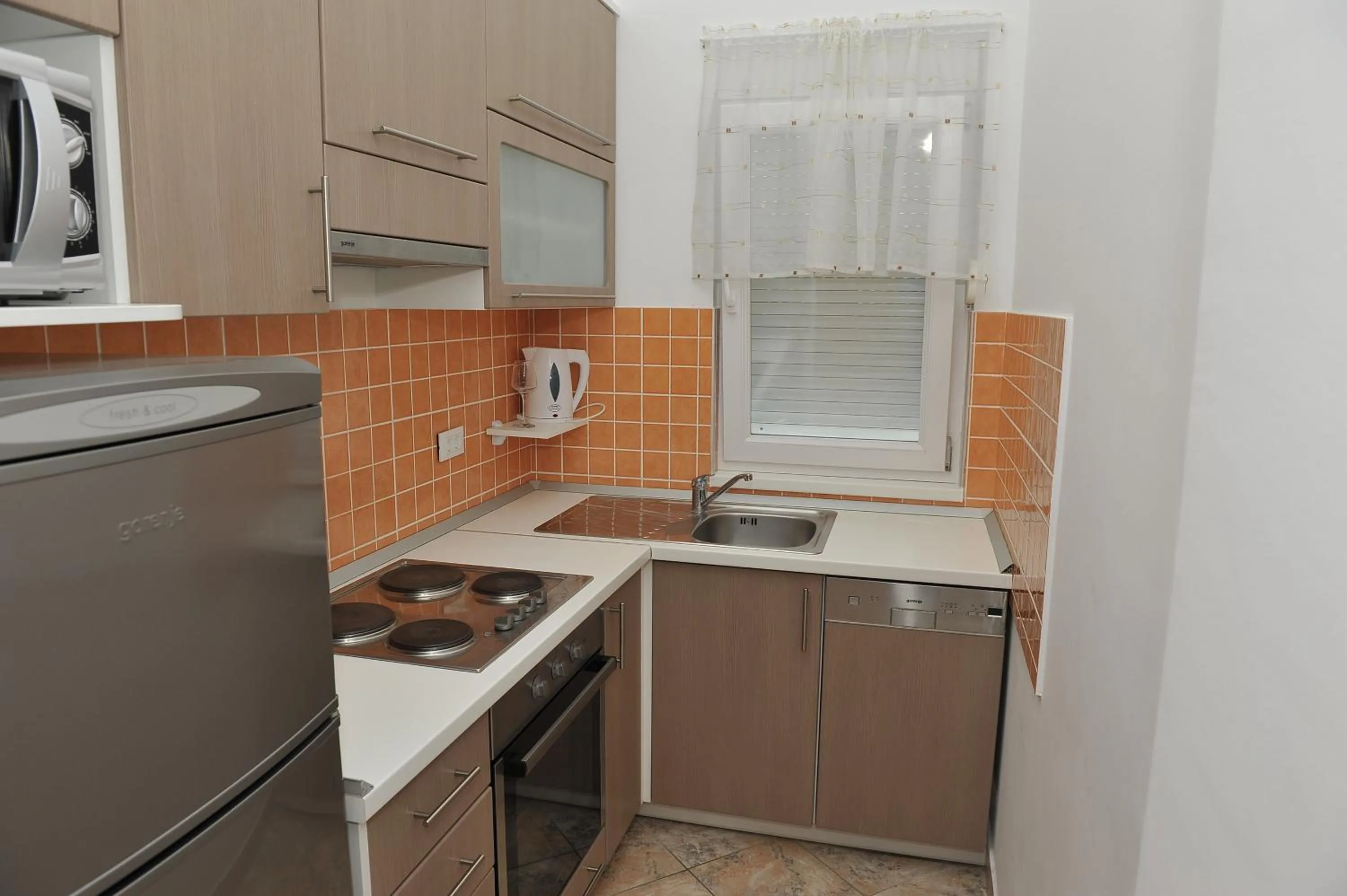 Kitchen or kitchenette in Apartments Martina