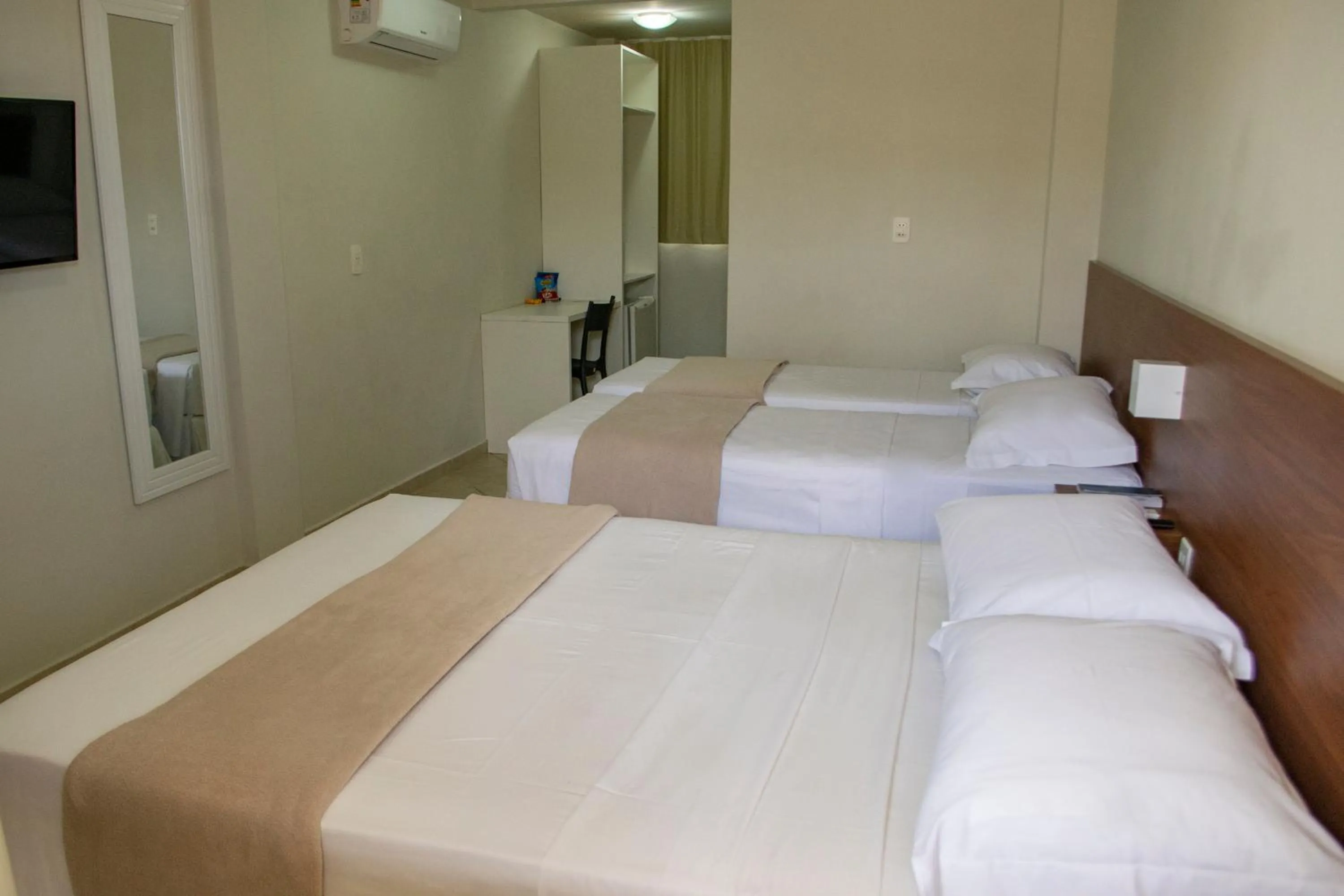 Bed in Pousada Laranja - Nova Administração