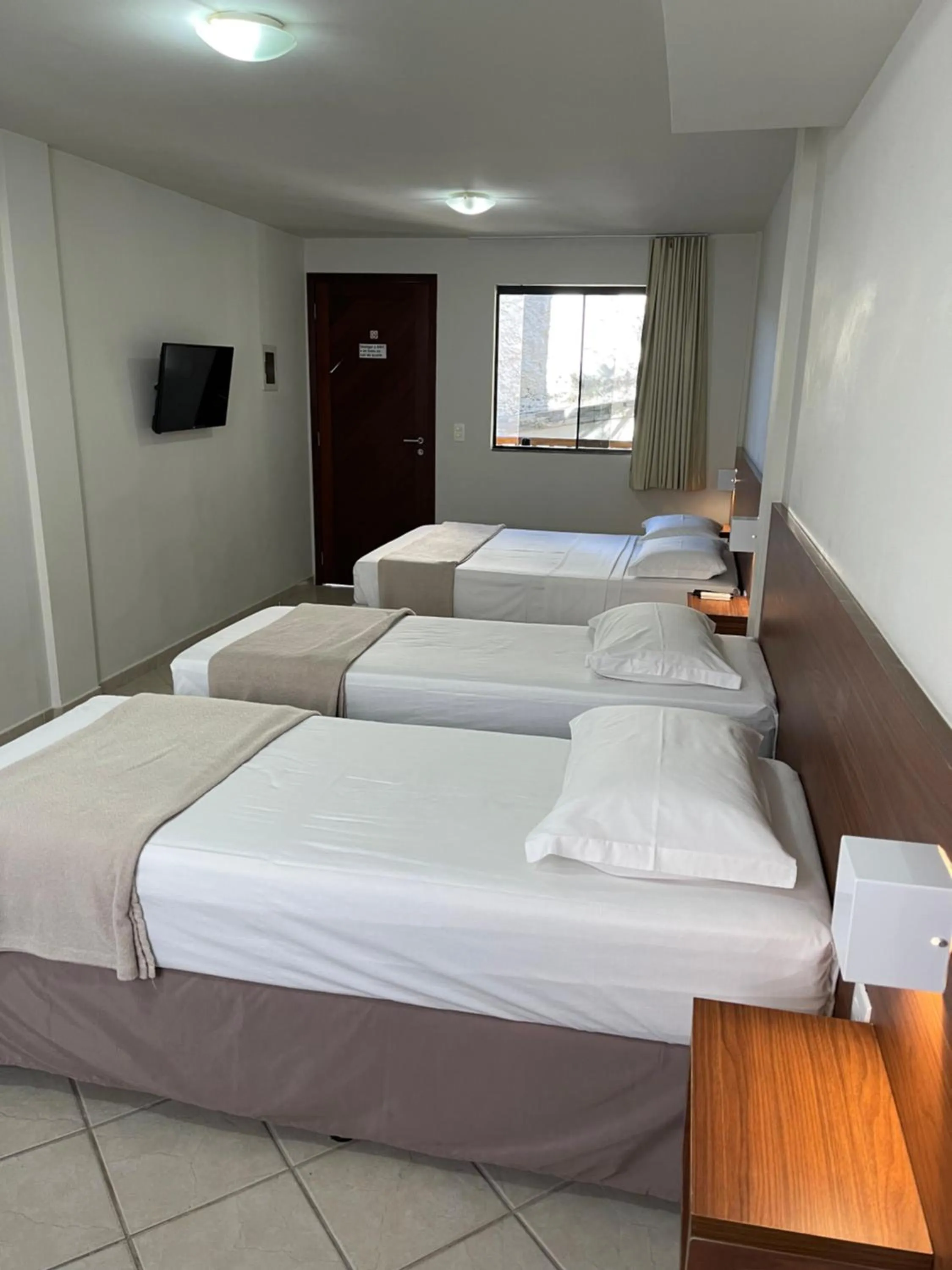 Bed in Pousada Laranja - Nova Administração