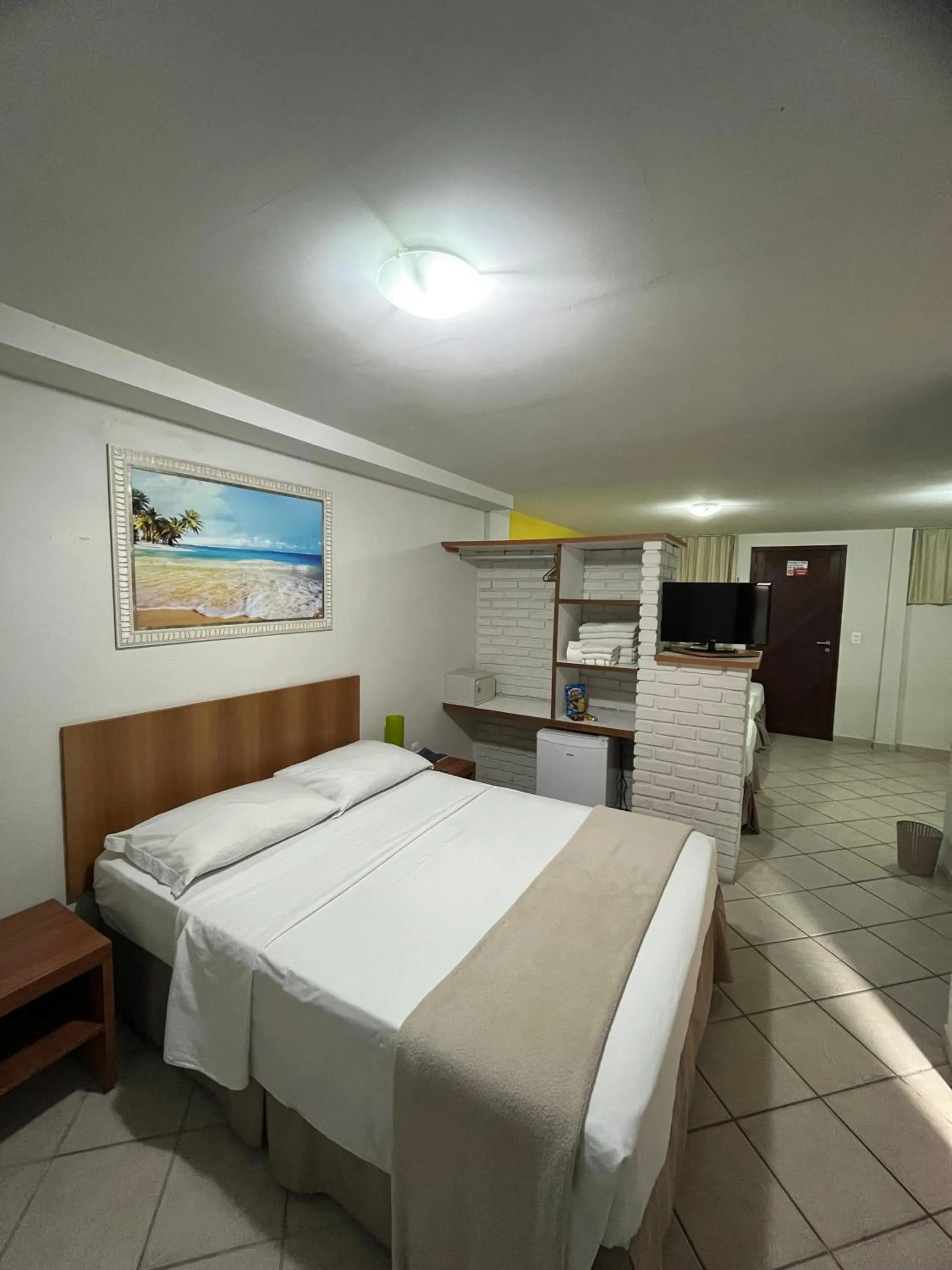 Bed in Pousada Laranja - Nova Administração