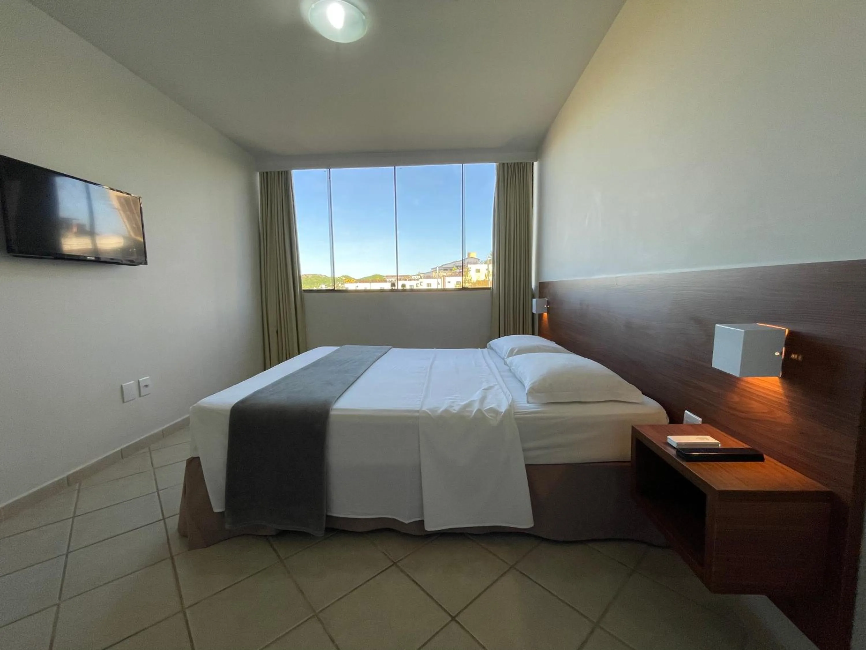 Bed in Pousada Laranja - Nova Administração