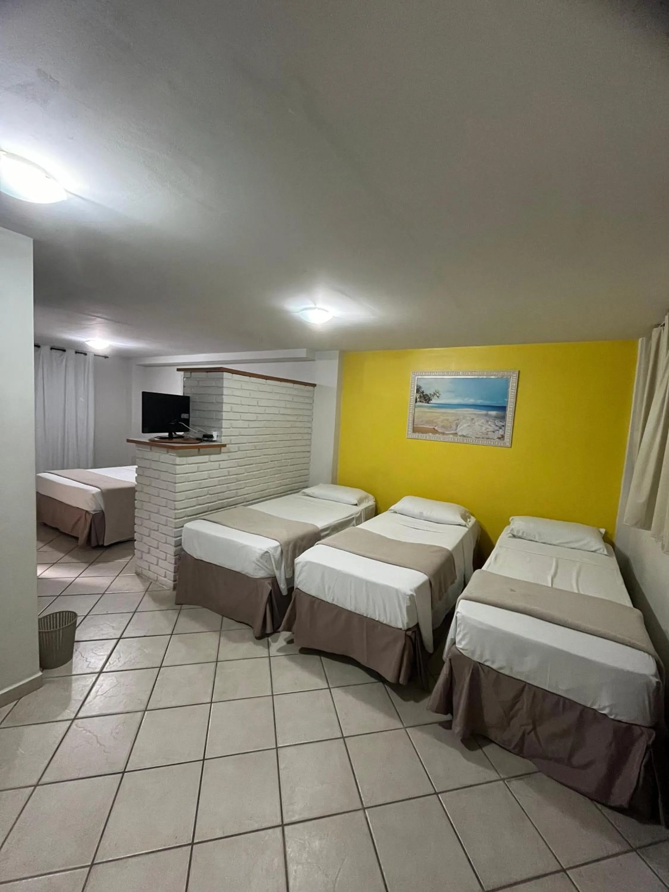 Bed in Pousada Laranja - Nova Administração