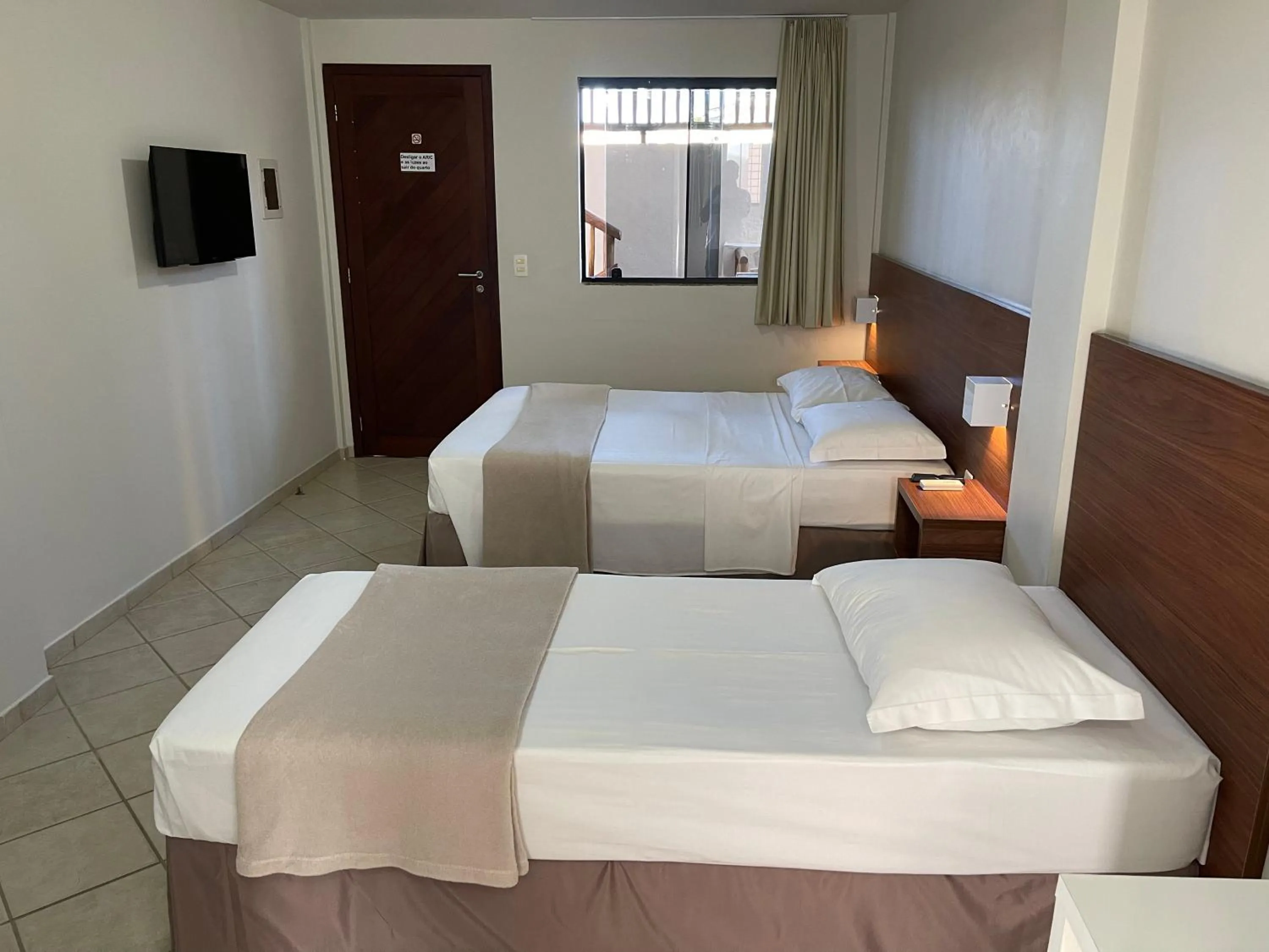 Bed in Pousada Laranja - Nova Administração