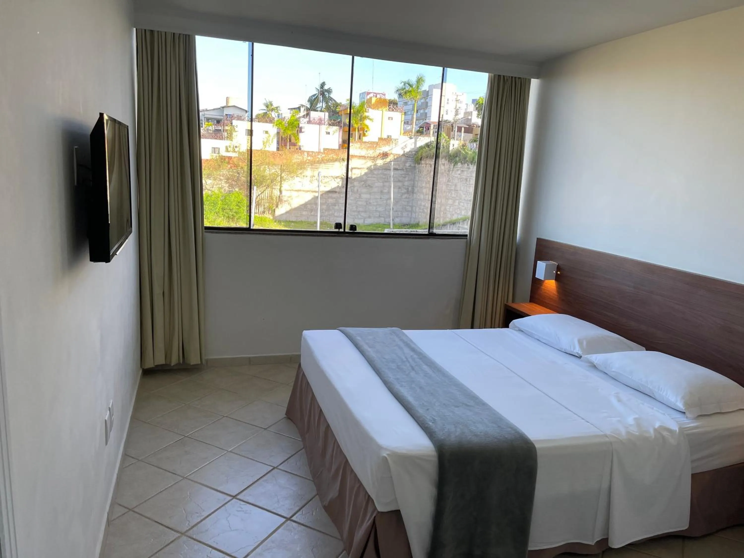 Bed in Pousada Laranja - Nova Administração