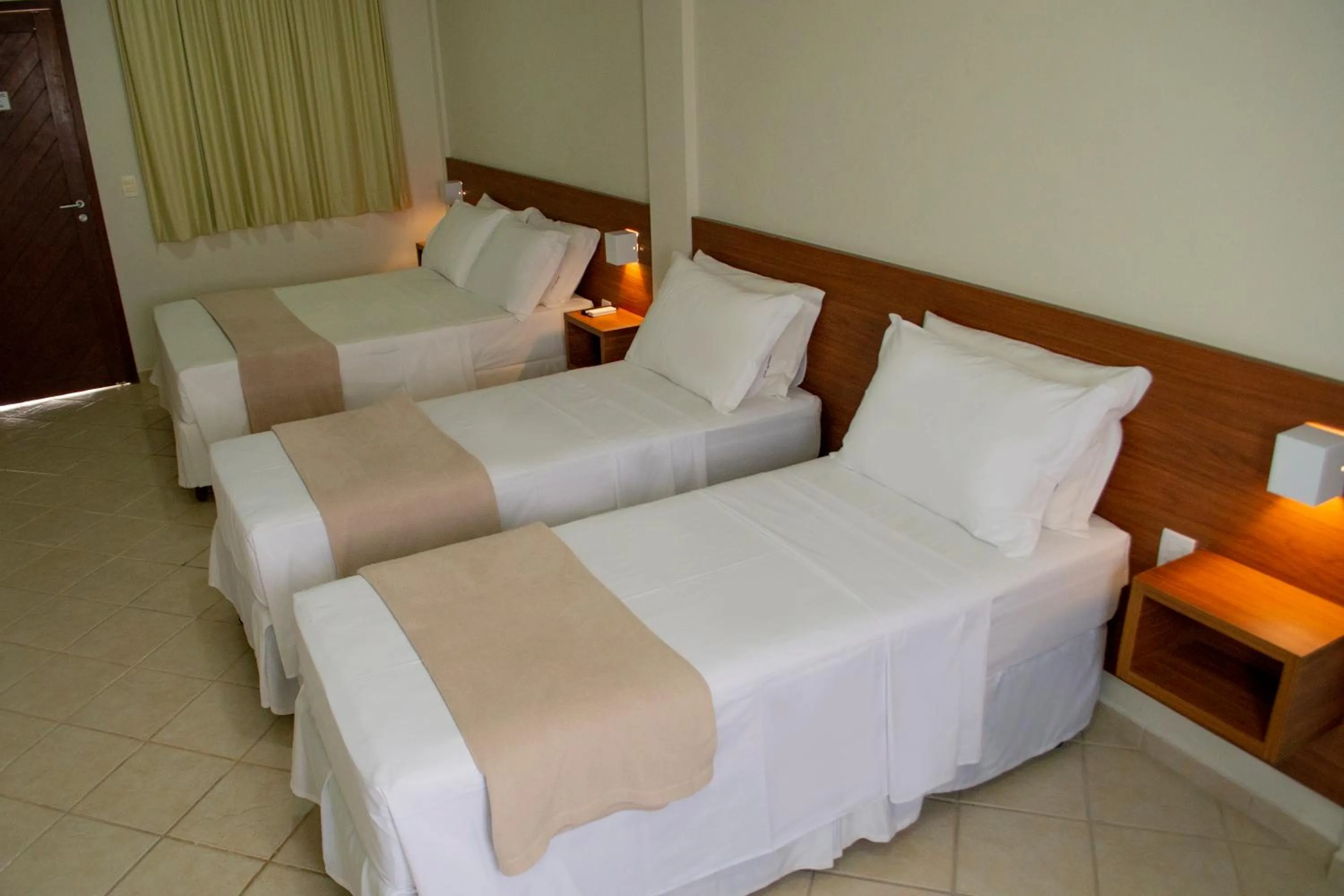 Bed in Pousada Laranja - Nova Administração