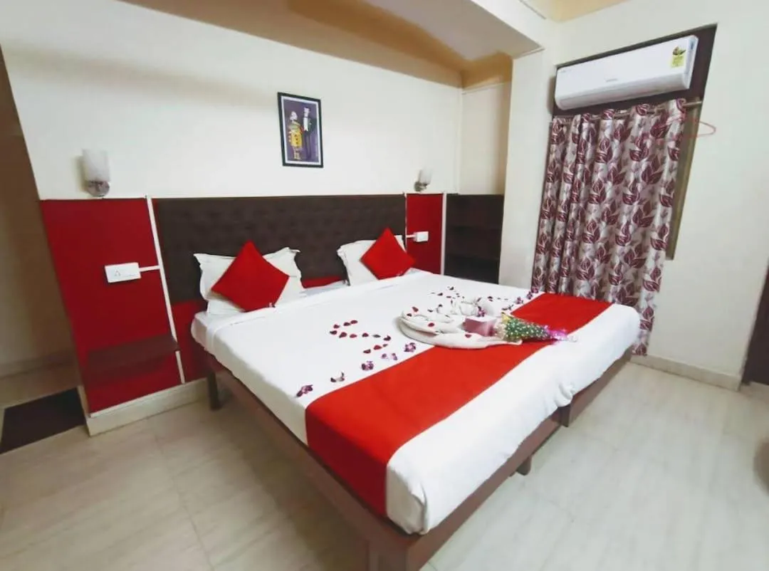 Bed in Sanman Hotels