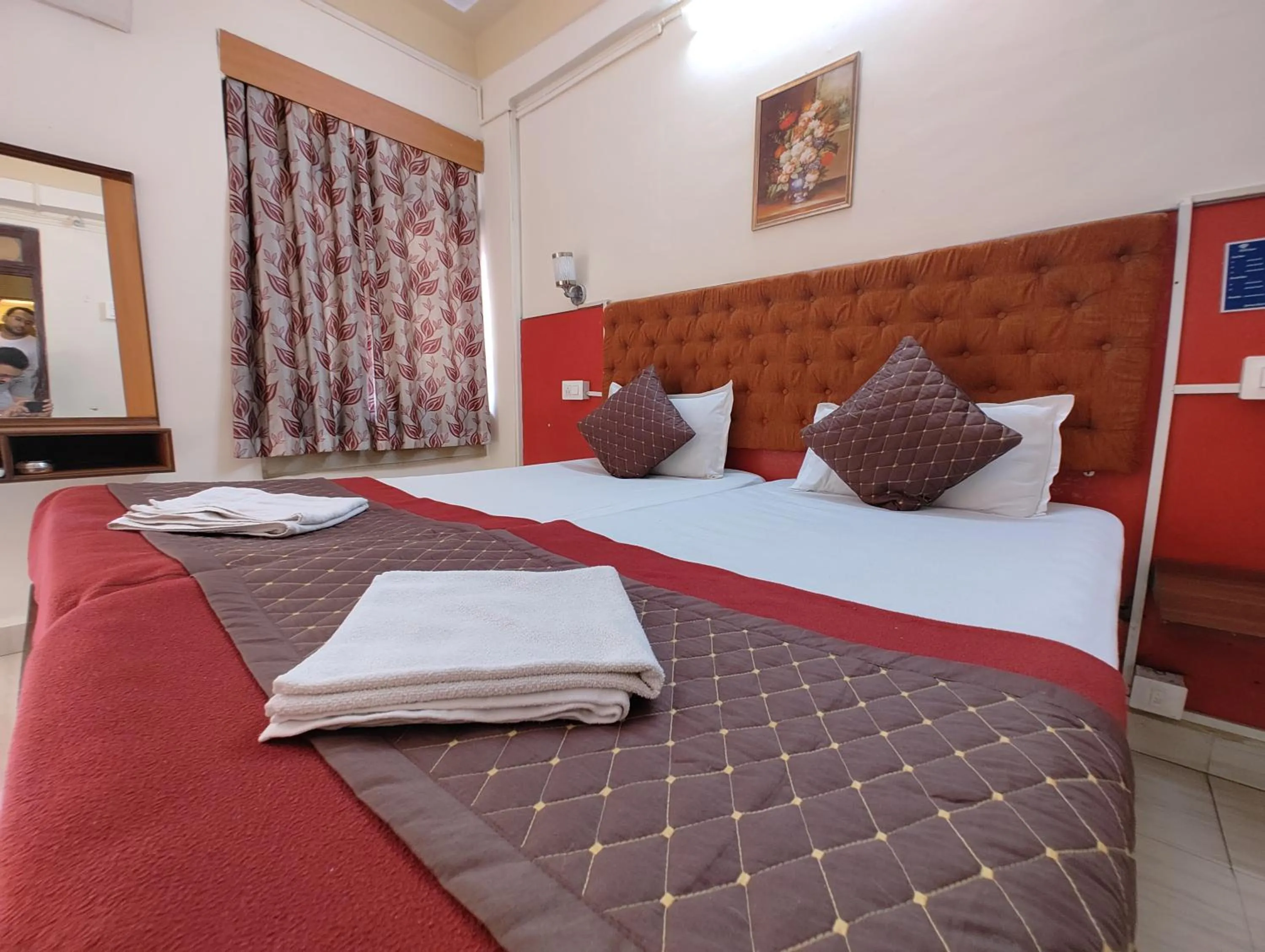 Bed in Sanman Hotels