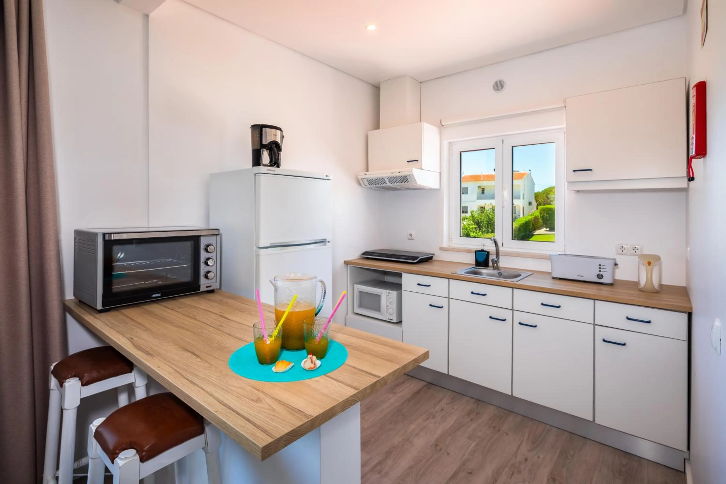 Kitchen or kitchenette in Apartamentos Flor da Laranja, Albufeira by AlgarveBlossom