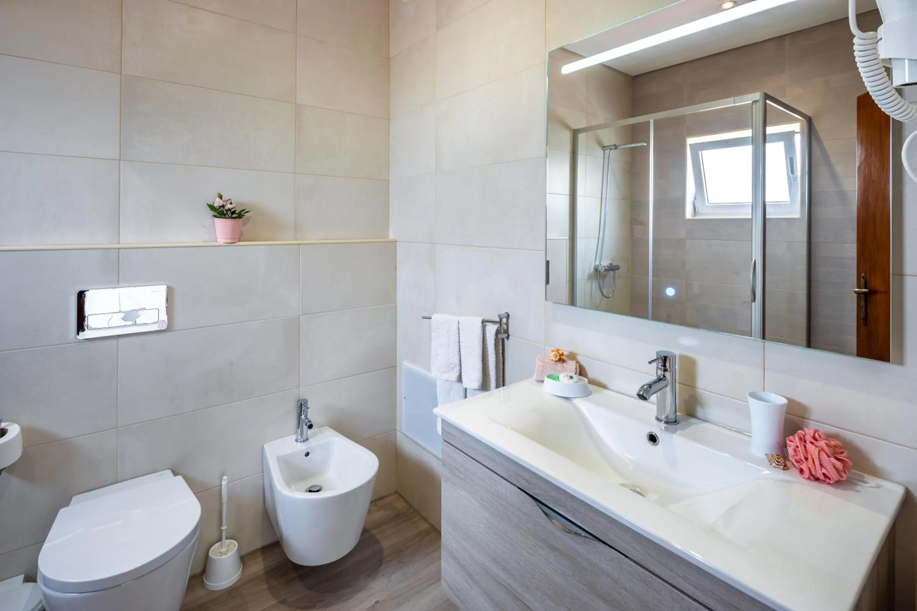 Bathroom in Apartamentos Flor da Laranja, Albufeira by AlgarveBlossom