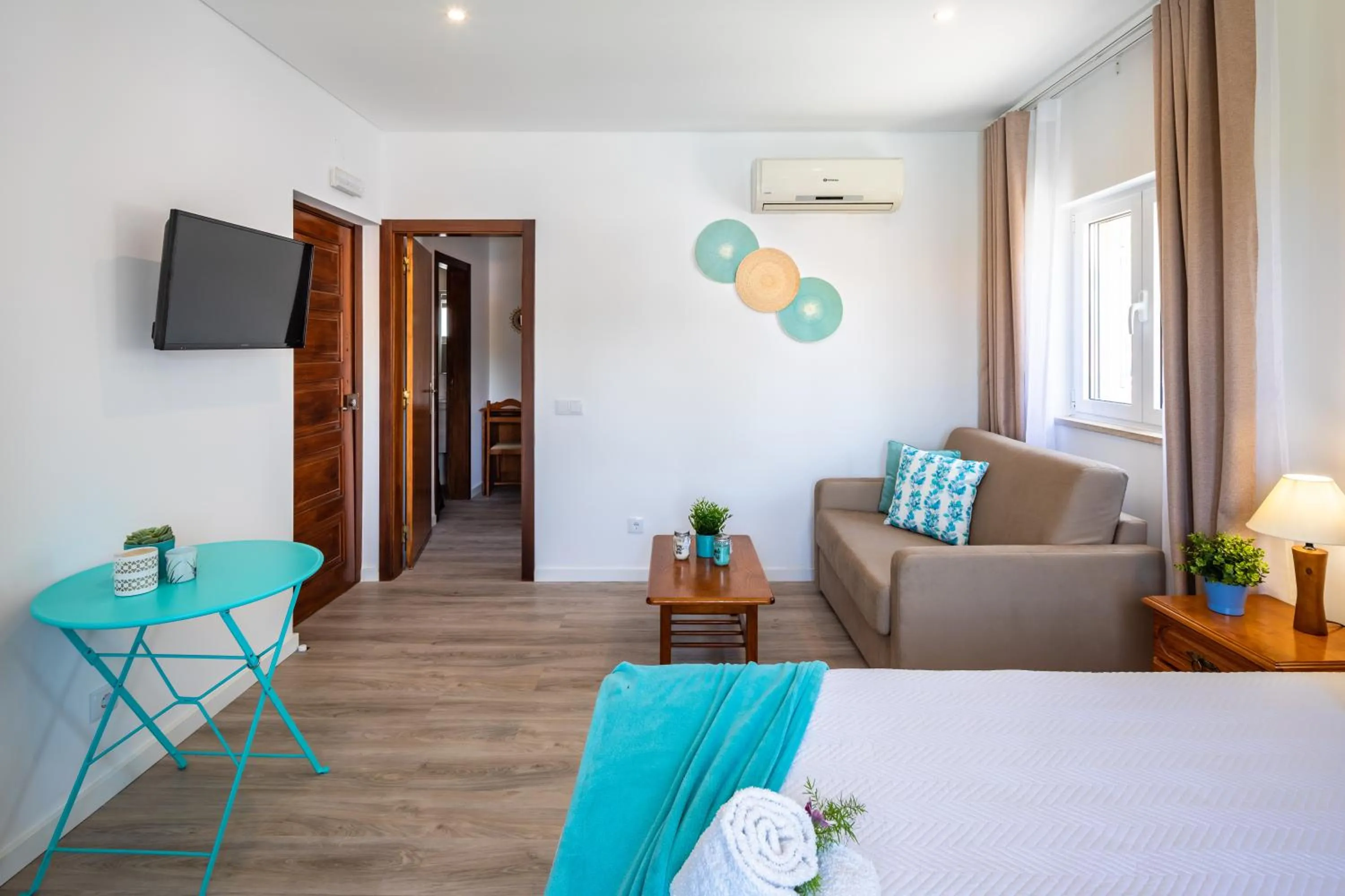 Communal lounge/ TV room, Bed in Apartamentos Flor da Laranja, Albufeira by AlgarveBlossom