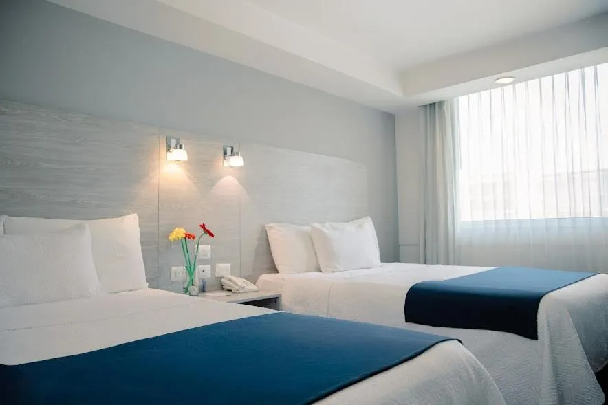 Bed in Kasa Hotel & Suites