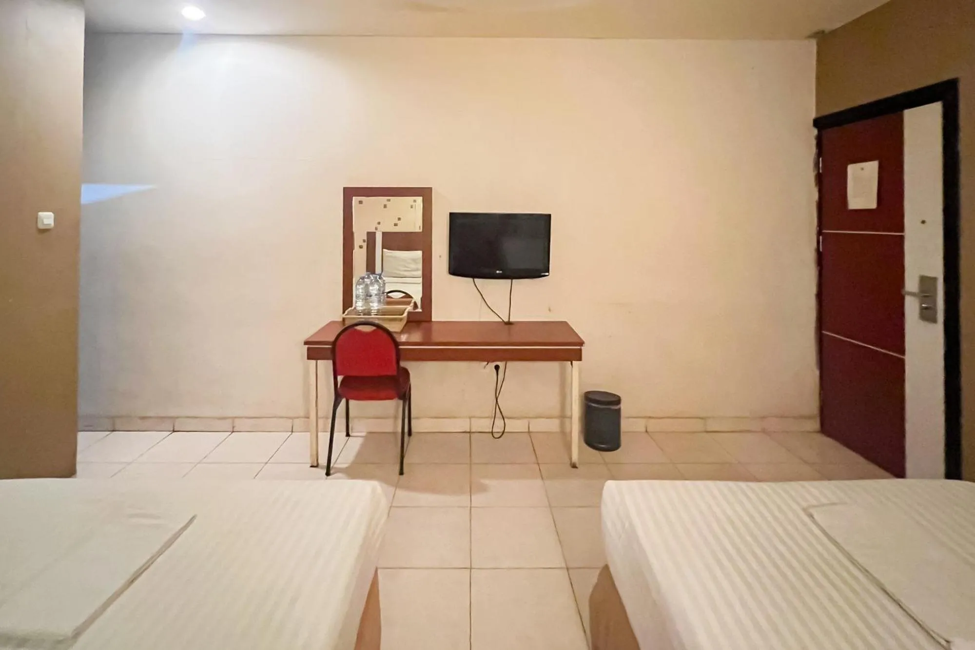 Bedroom, Bed in Urbanview Trisula Hotel Makassar