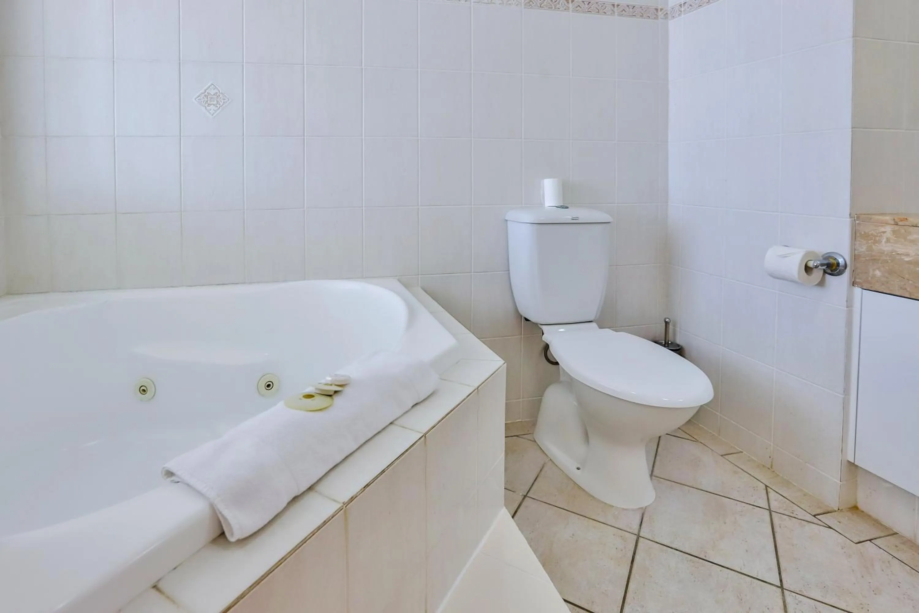 Toilet in Regency on the Beach