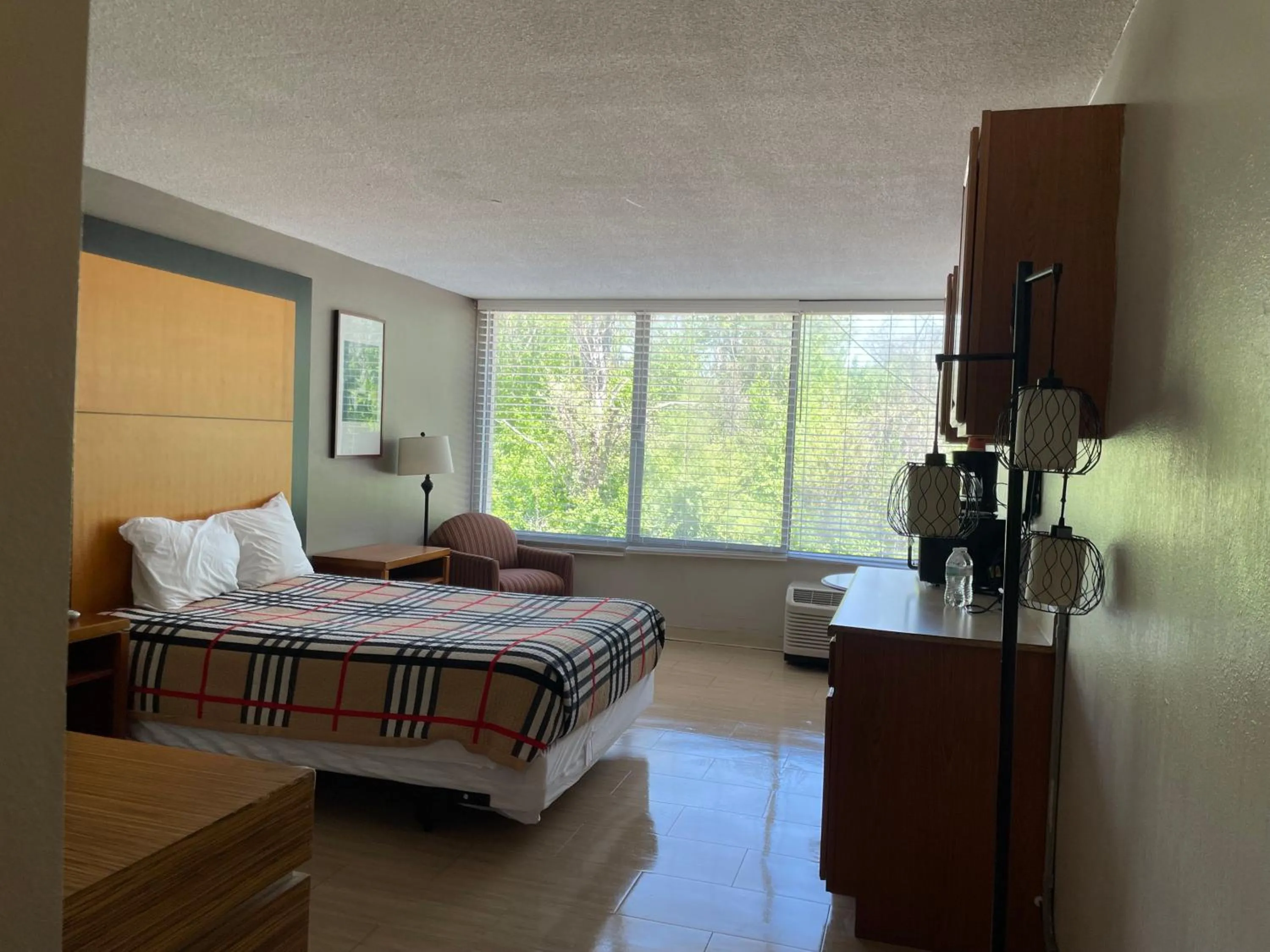 Bed in APM Inn & Suites