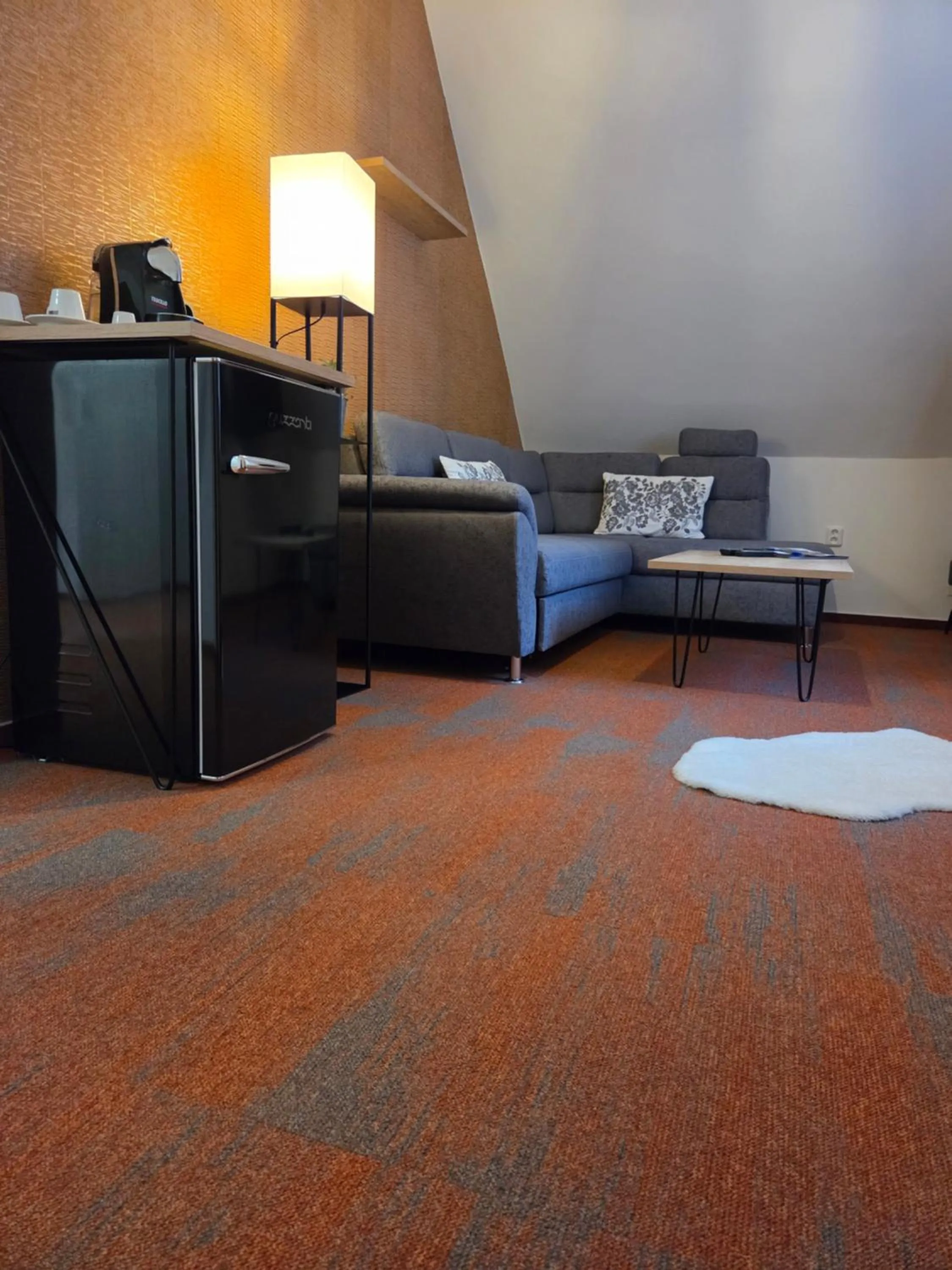 Living room, Bed in Hotel Skicentrum