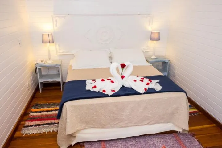 Bed in Pousada Solar D'Araucaria