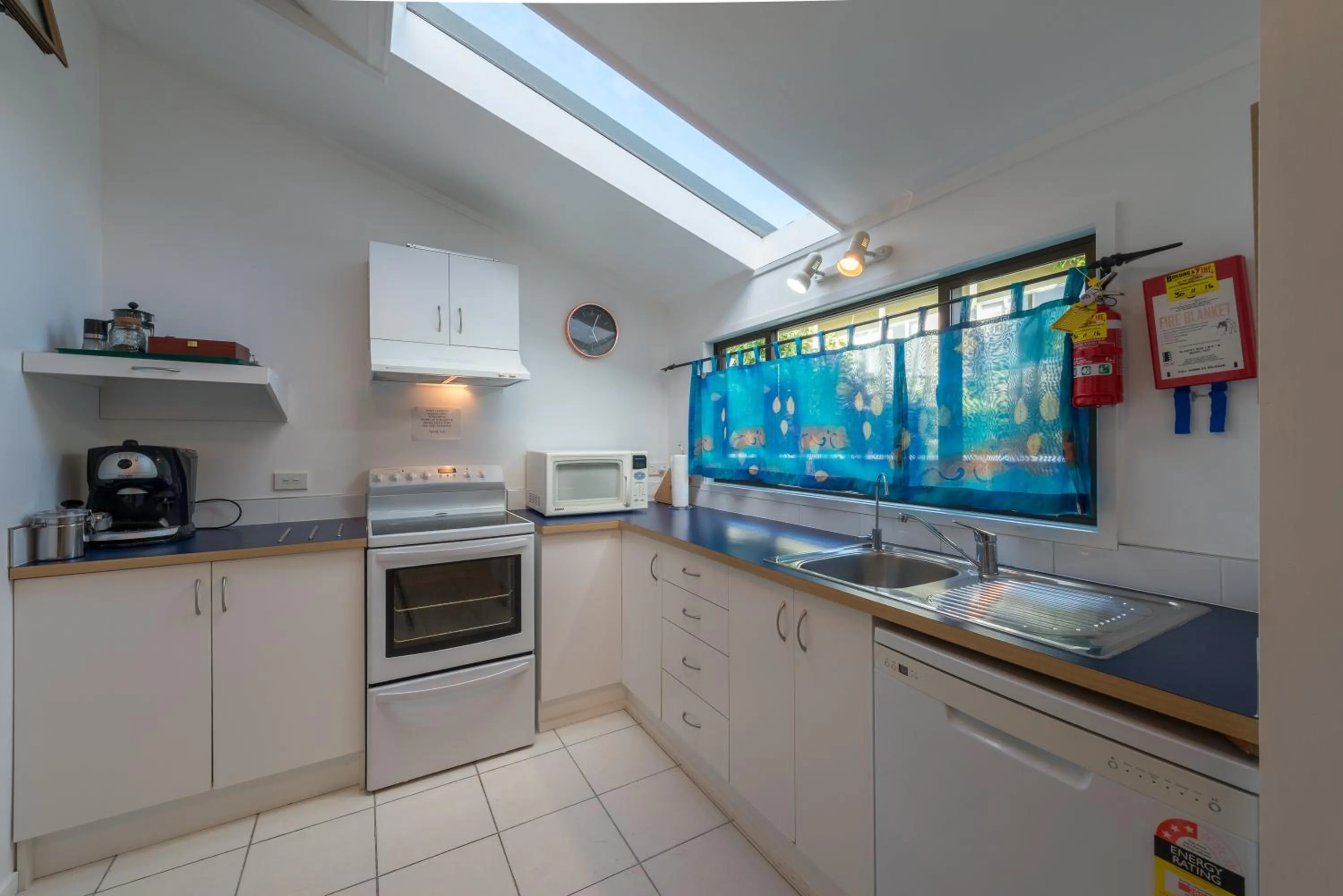 Kitchen or kitchenette in By the Bay Beachfront Apartments