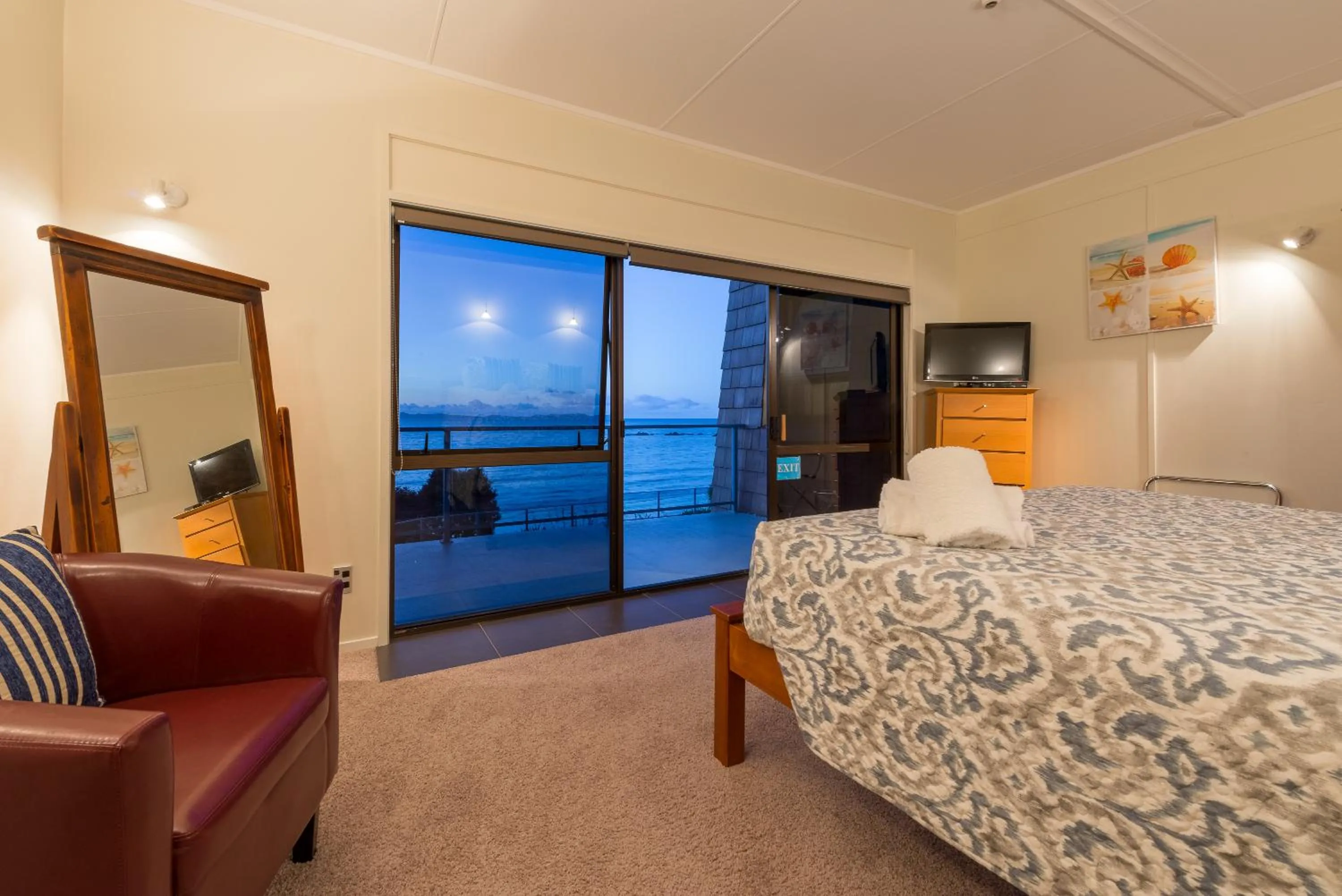 Photo of the whole room, Bed in By the Bay Beachfront Apartments