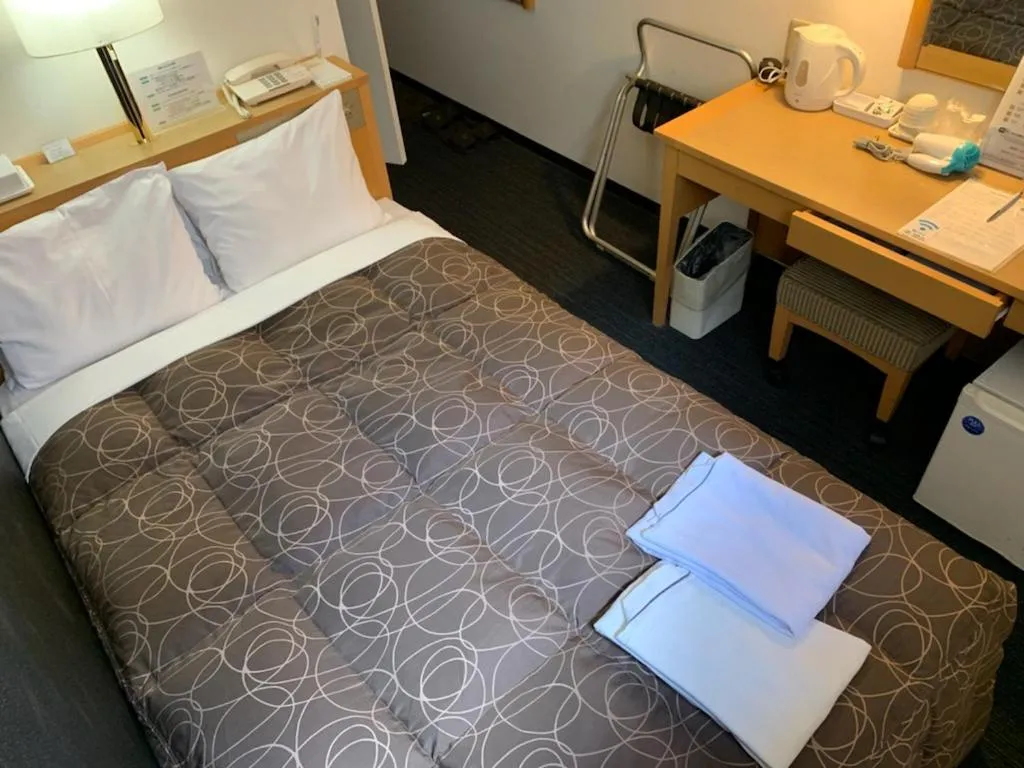 Photo of the whole room, Bed in AZ Inn Obu