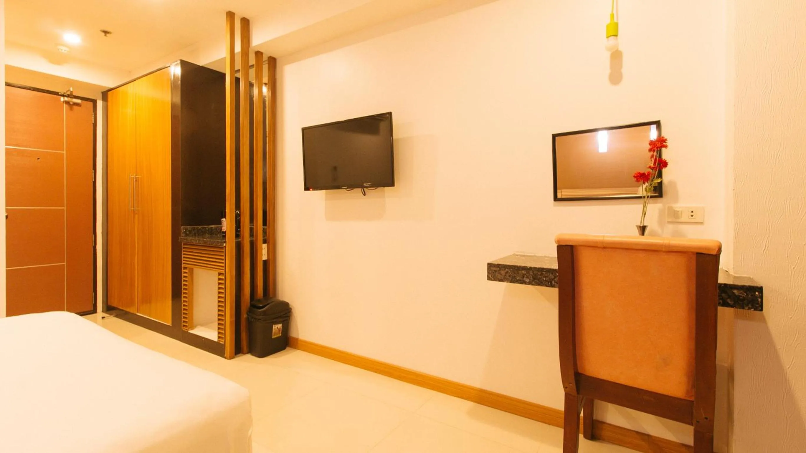 TV and multimedia, Bed in Guijo Suites Makati