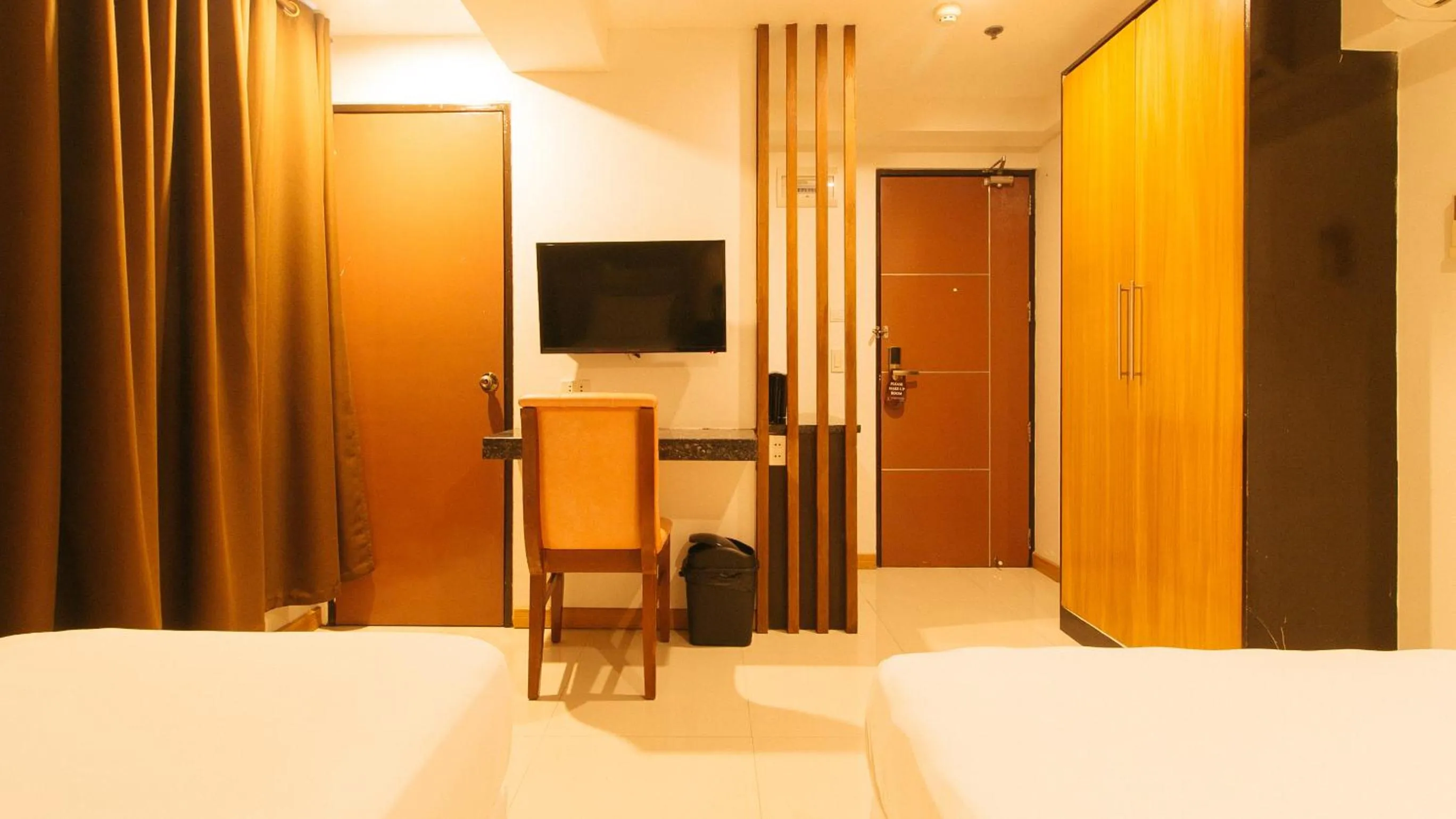 TV and multimedia, Bed in Guijo Suites Makati