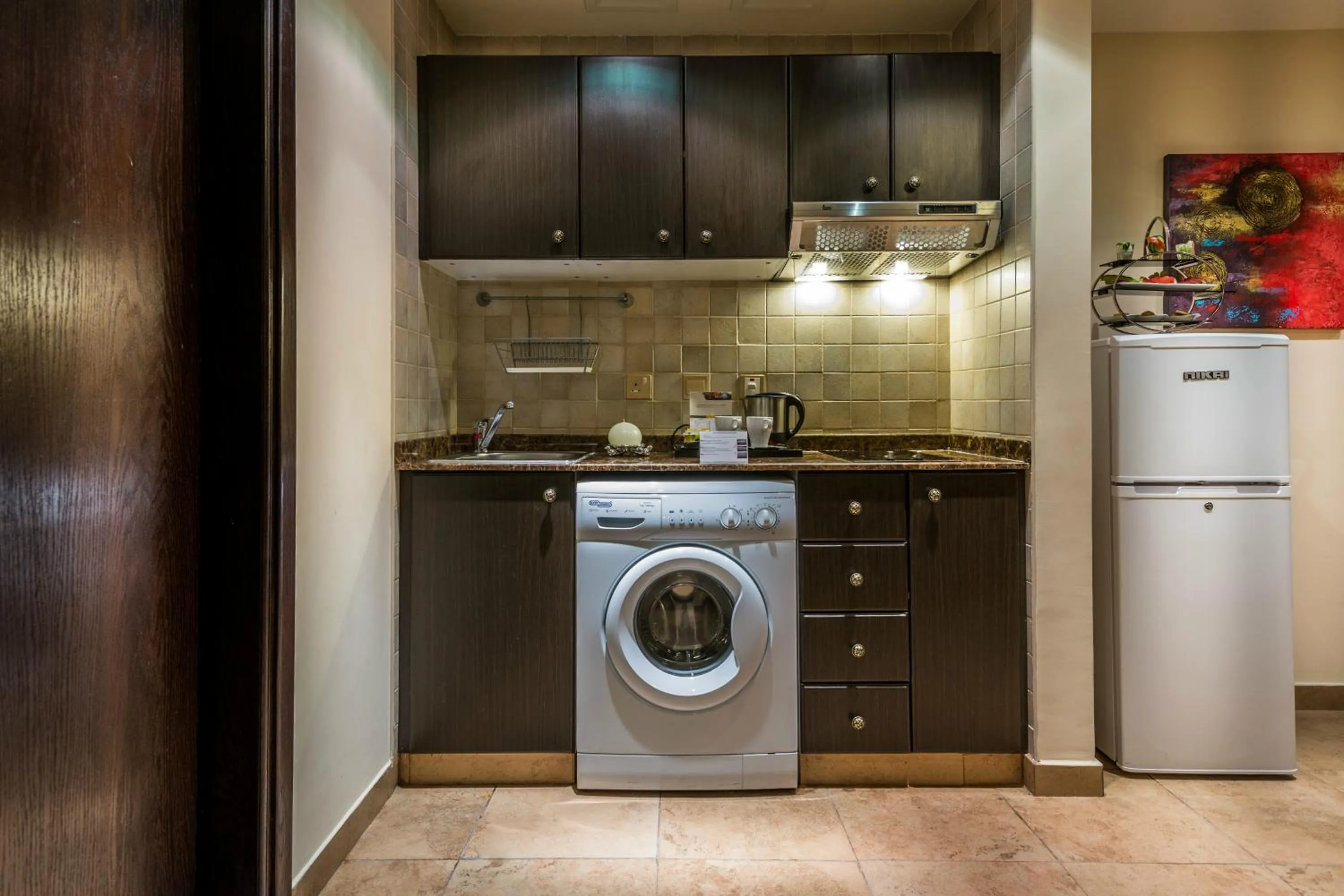 Kitchen or kitchenette in First Central Hotel Suites