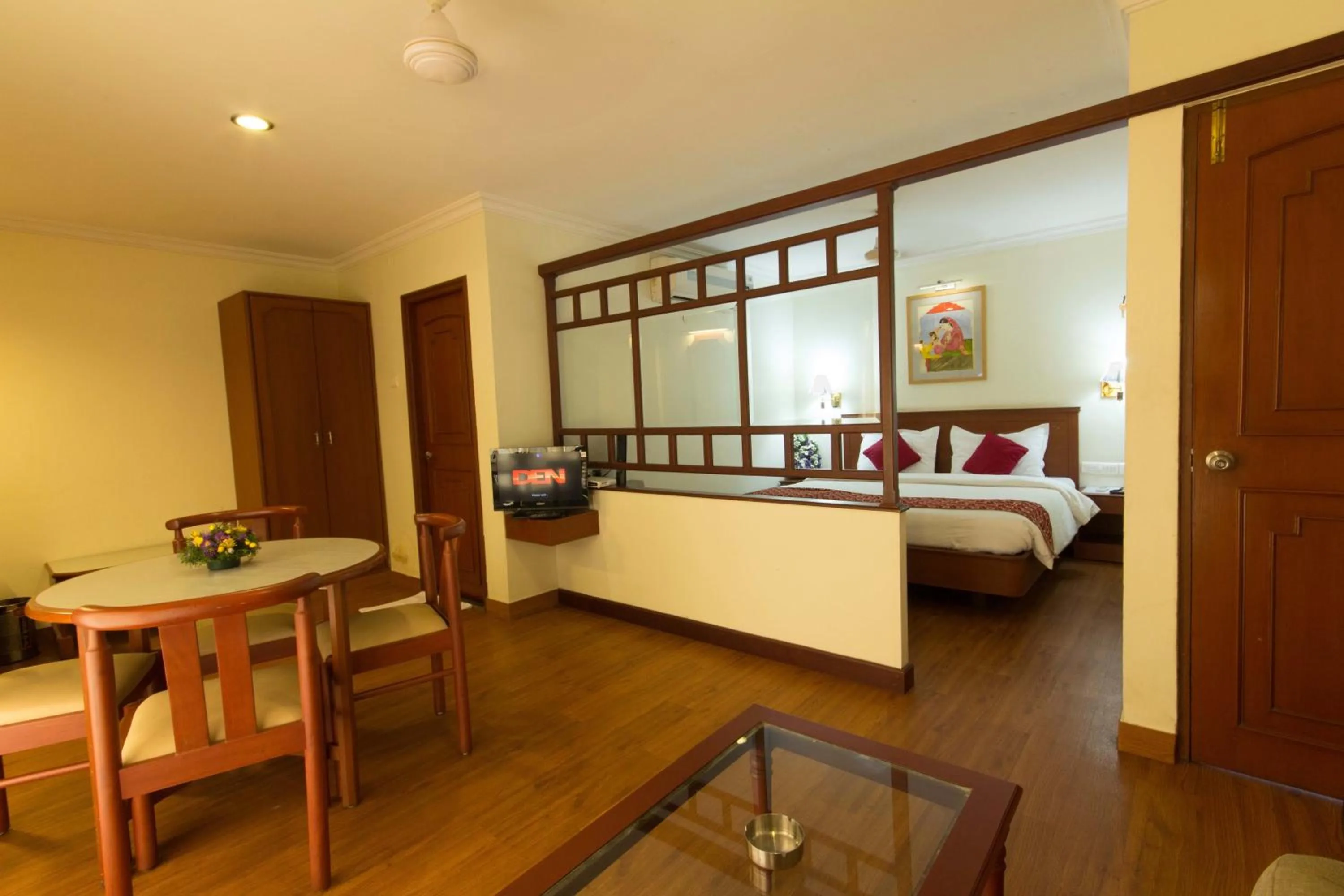 Seating area, Bed in Hotel Aiswarya