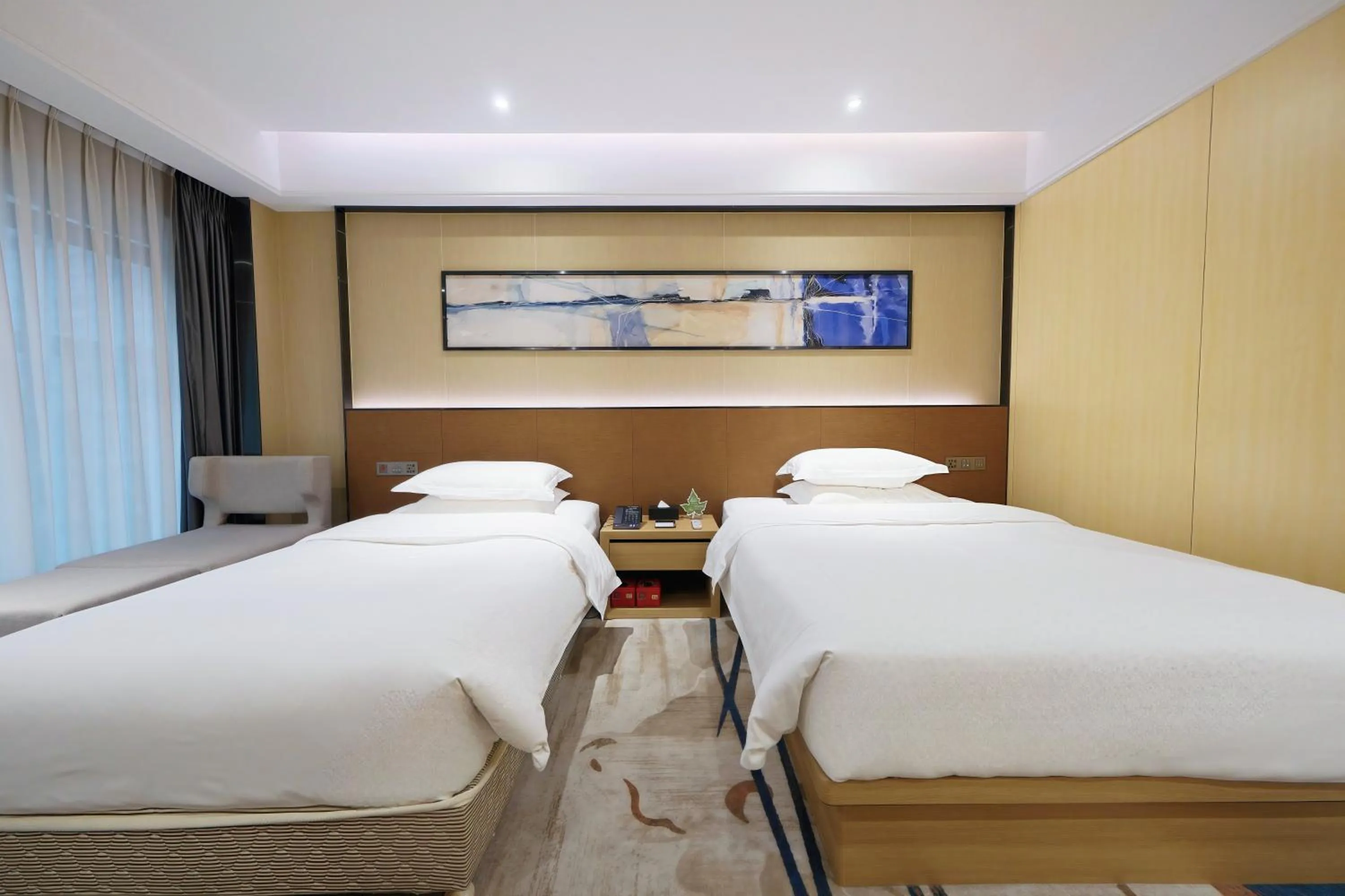 Bed in Landmark International Hotel