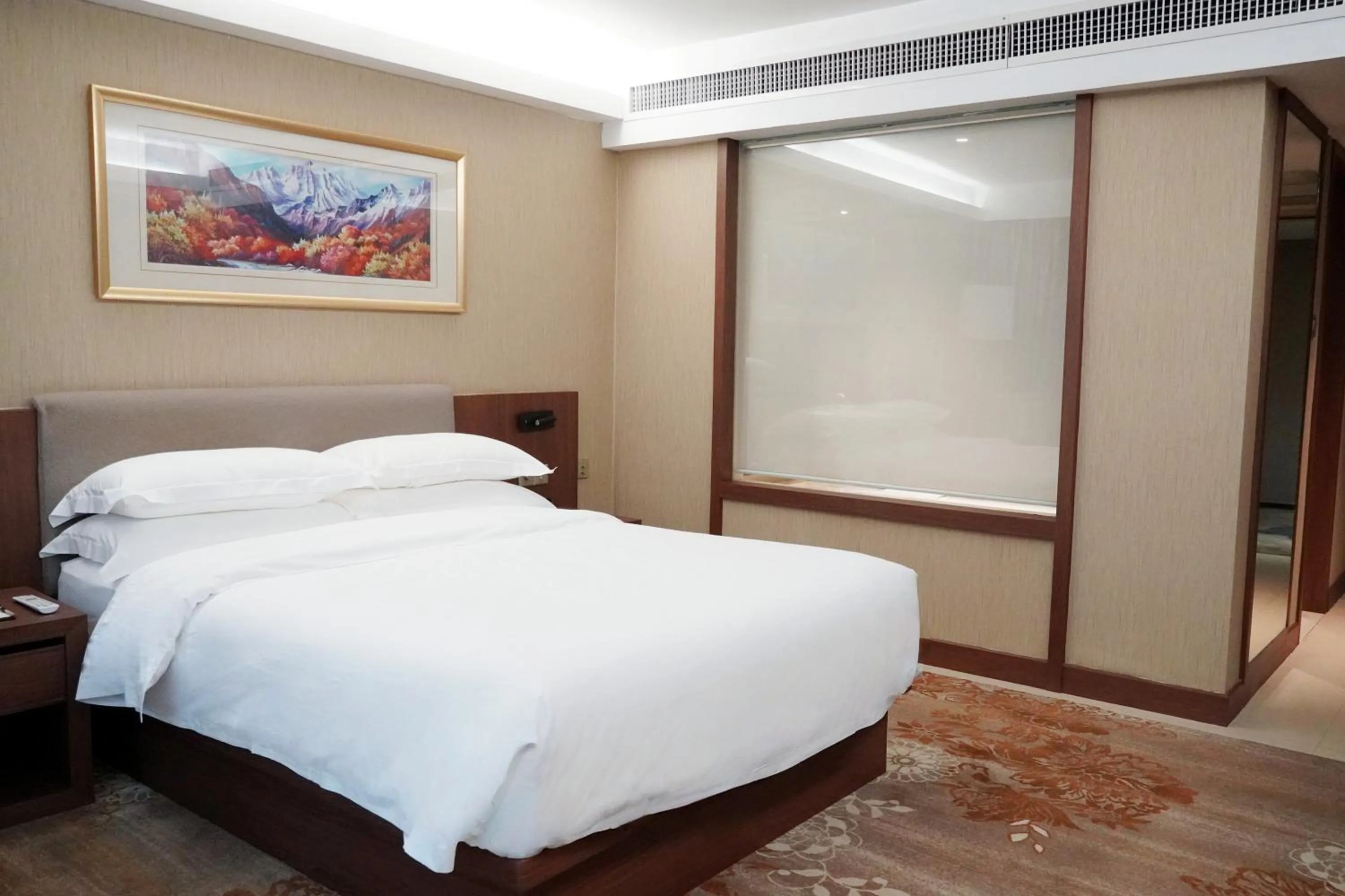 Bed in Landmark International Hotel