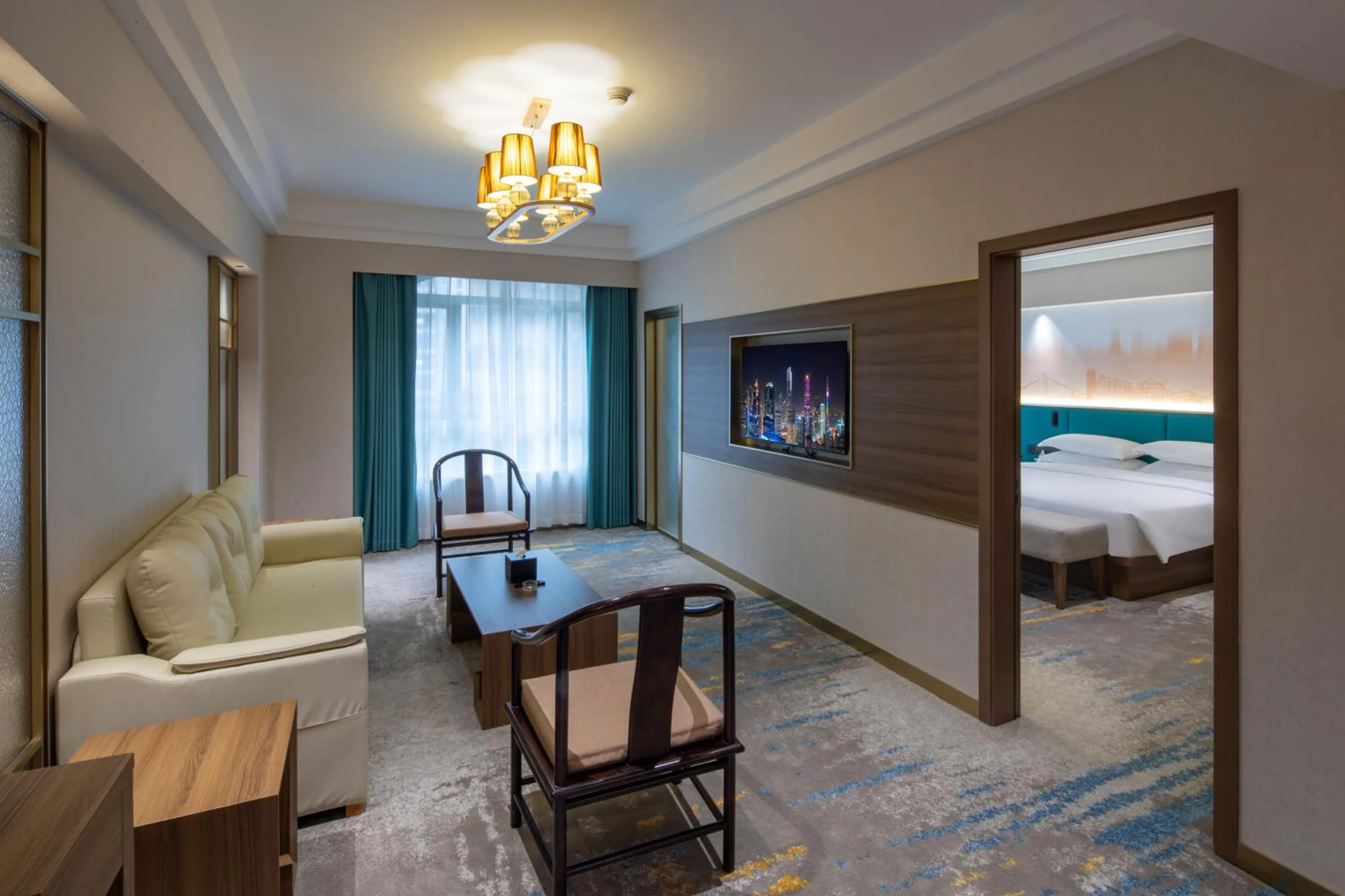 Living room, Bed in Landmark International Hotel